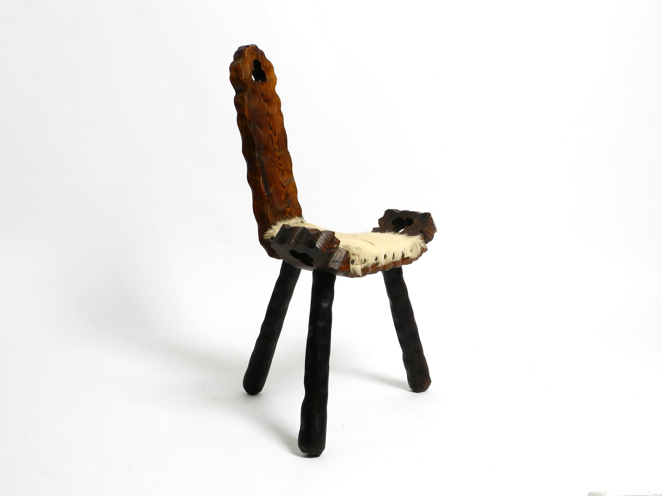1950s three-legged stool made of solid wood in black-brown with cowhide seat For Sale 7