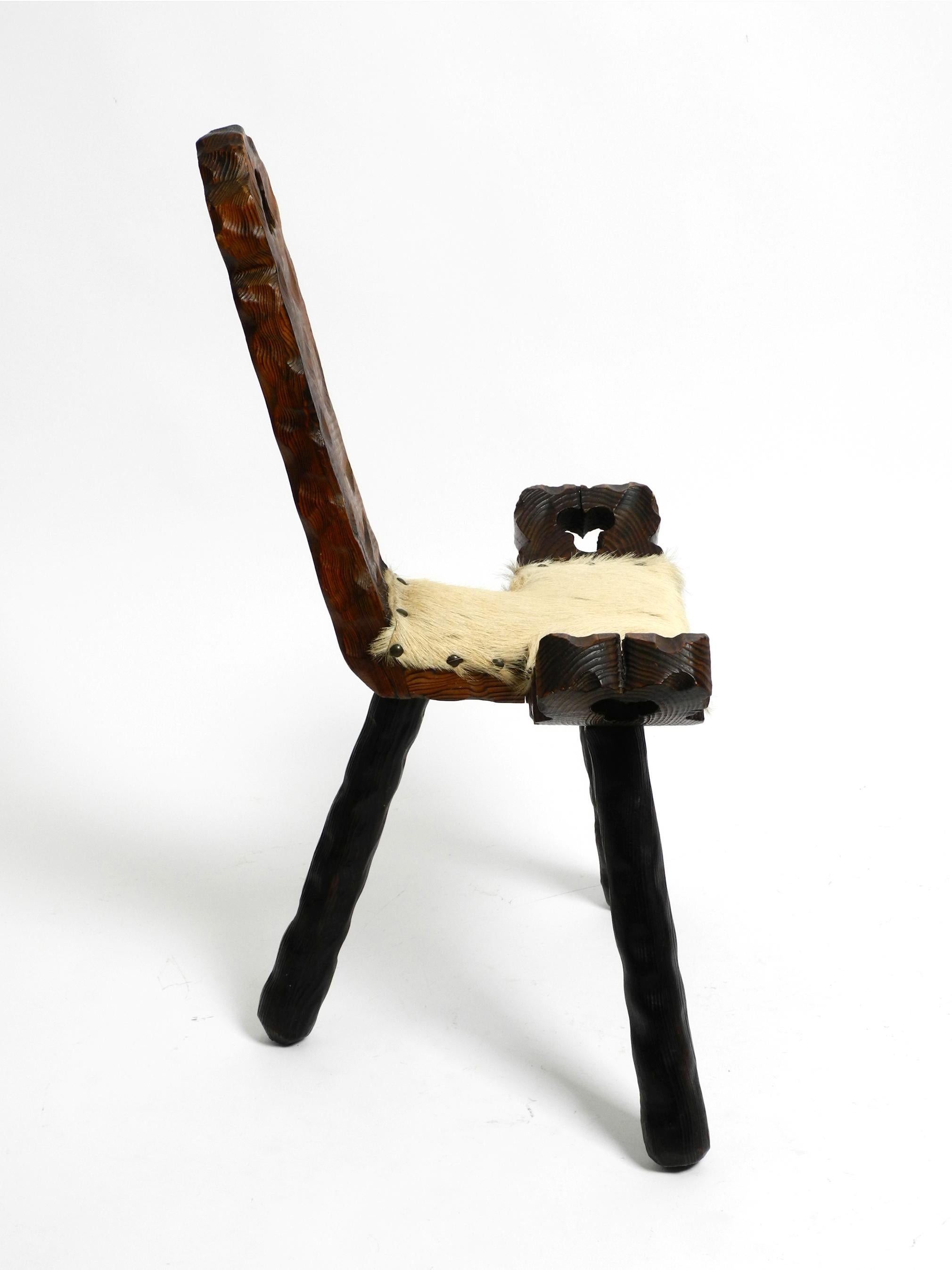 1950s three-legged stool made of solid wood in black-brown with cowhide seat For Sale 9