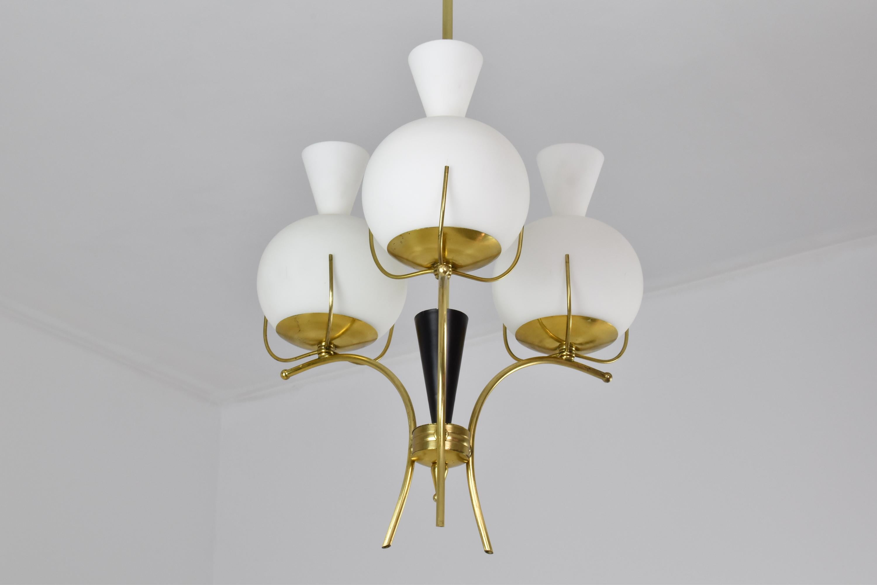 A sculptural 20th-century Italian vintage pendant light designed by the iconic Italian designer Angelo Lelli in the 1950s. This magnificent collectible piece is highlighted by the slender brass structure and original opaline glass shades. 
Italy.