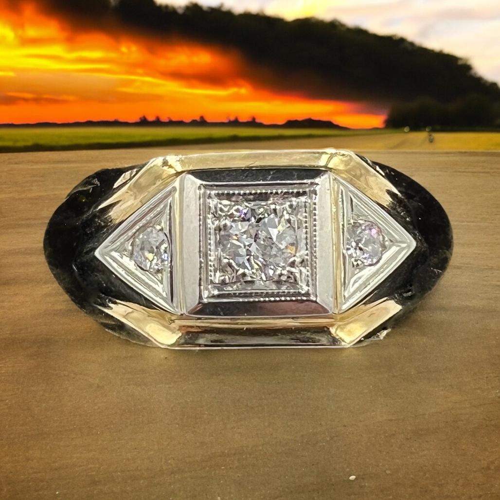 1950s Three-stone diamond two-tone gold mens ring.

The 1950s three-stone diamond two-tone gold mens ring is an iconic piece of jewelry from this period.  This ring represents the epitome of mid-century design, with its sleek lines and timeless