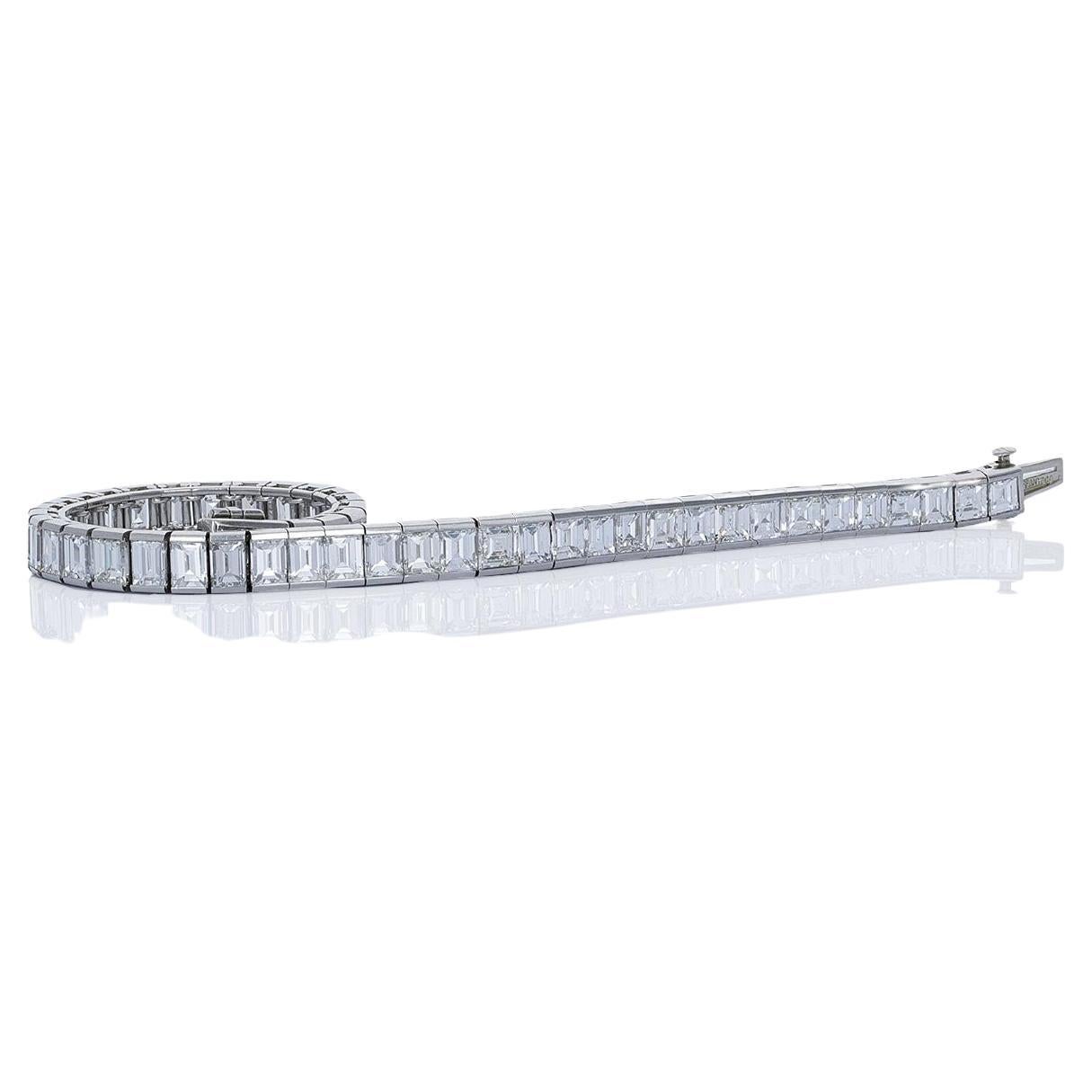 Tiffany & Co. 1950's, straight line emerald cut diamond platinum tennis bracelet. The bracelet was made beautifully and has been kept in pristine condition. There are a total of 48 emerald cut diamonds weighing approximately 16 carats. The diamonds
