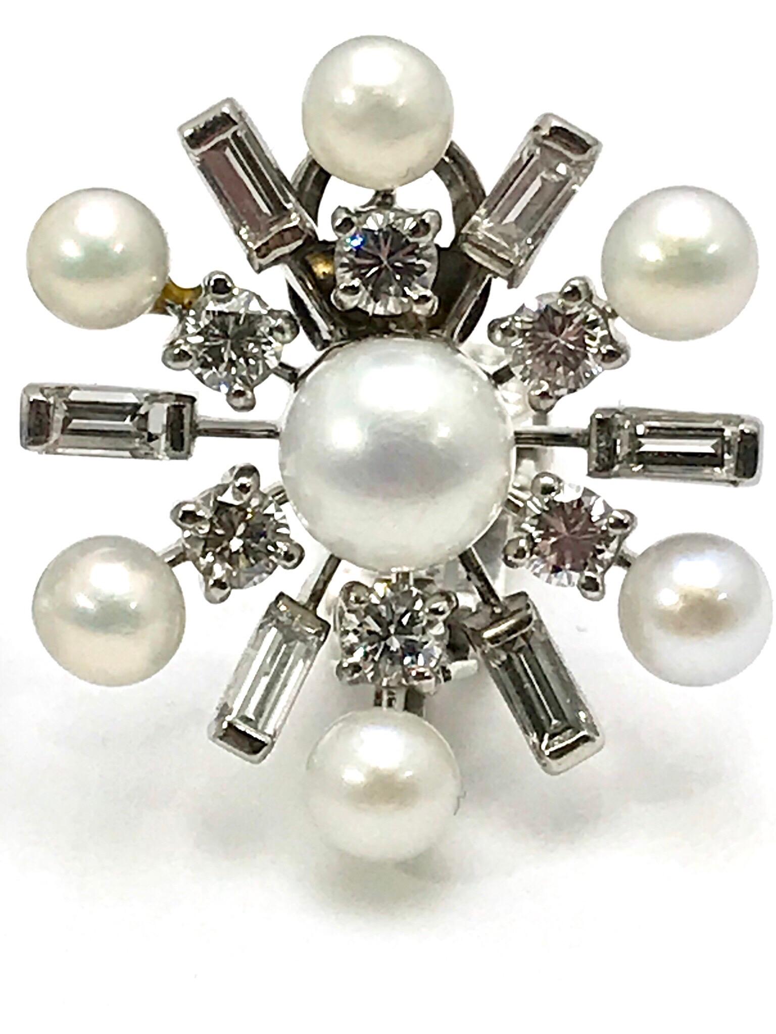 This is a gorgeous pair of Tiffany & Co. Diamond and Cultured Pearl 14 karat white gold clip back earrings.  The Diamonds are a combination of round brilliant cuts and baguettes.  The 1.68 carats of Diamonds are graded as F-G color, VS clarity, and