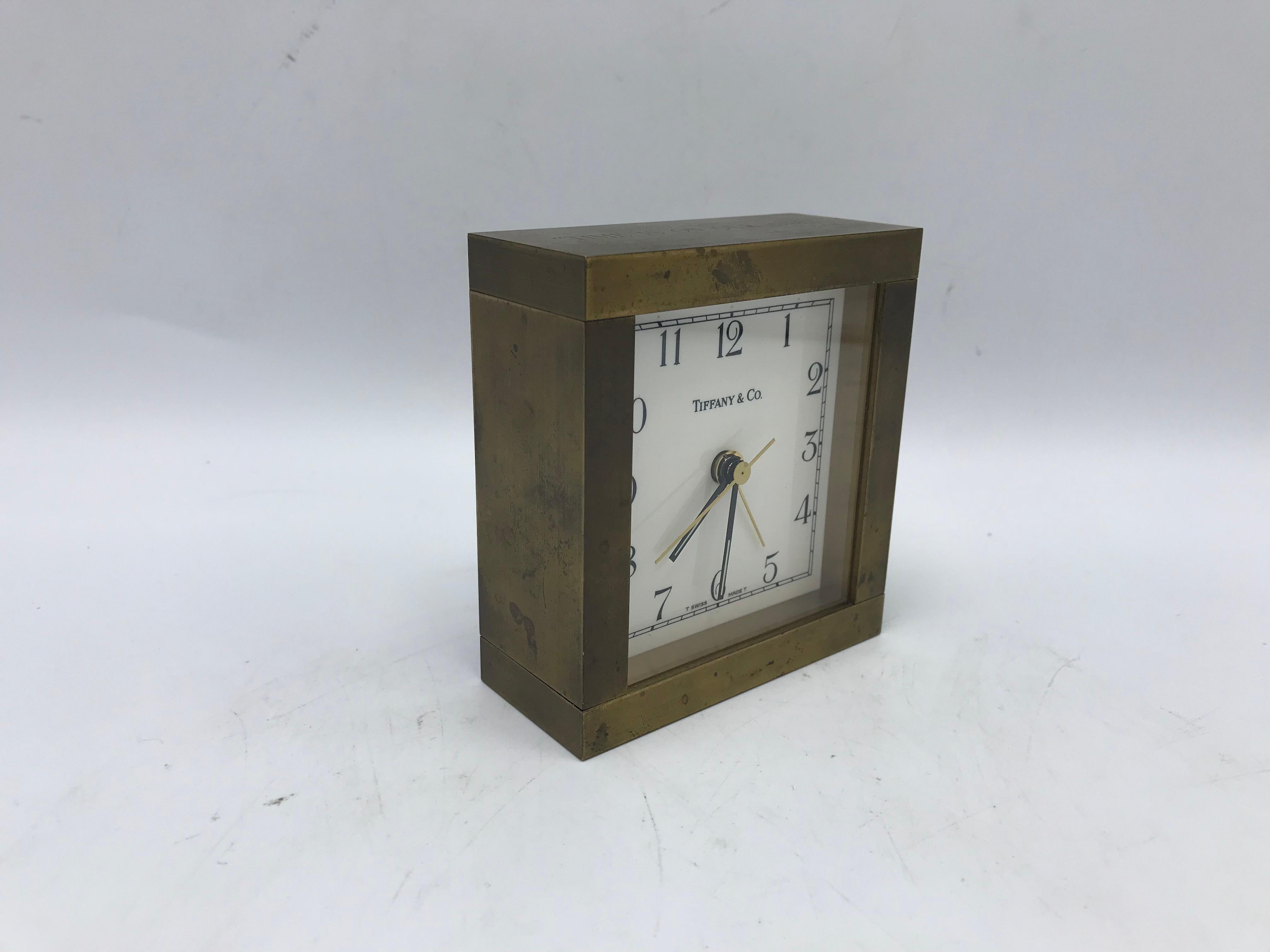 Offered is a fabulous, 1950s Tiffany & Co. modern brass desk or travel clock. Engraved along the top, 