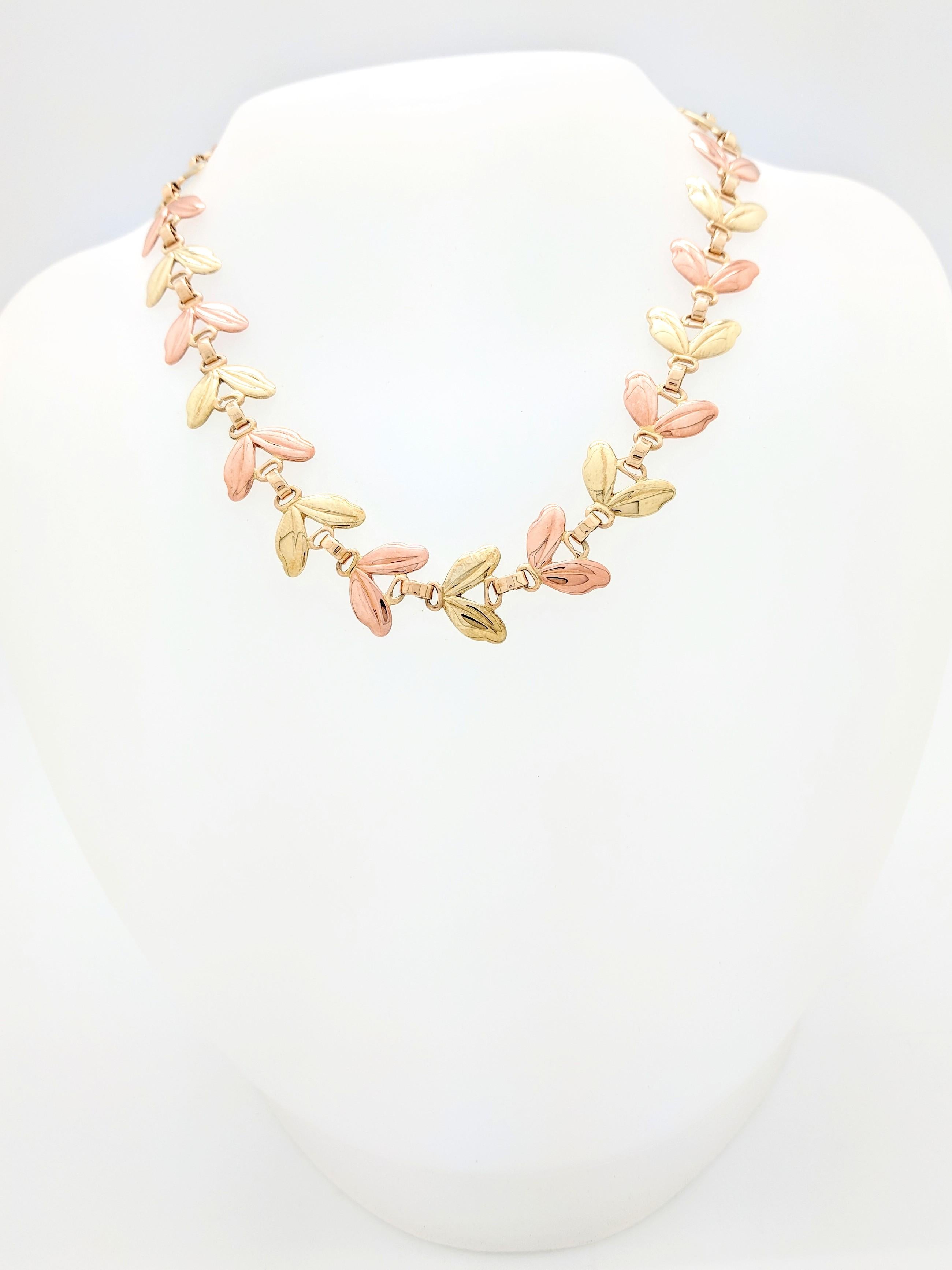 You are viewing an Authentic RARE Vintage Tiffany & Co. 14 karat Two Tone Gold Leaf Link Necklace. This necklace is from the early 1950's and is crafted from 14 karat pink and yellow gold. The yellow gold portion of the necklace has a slightly