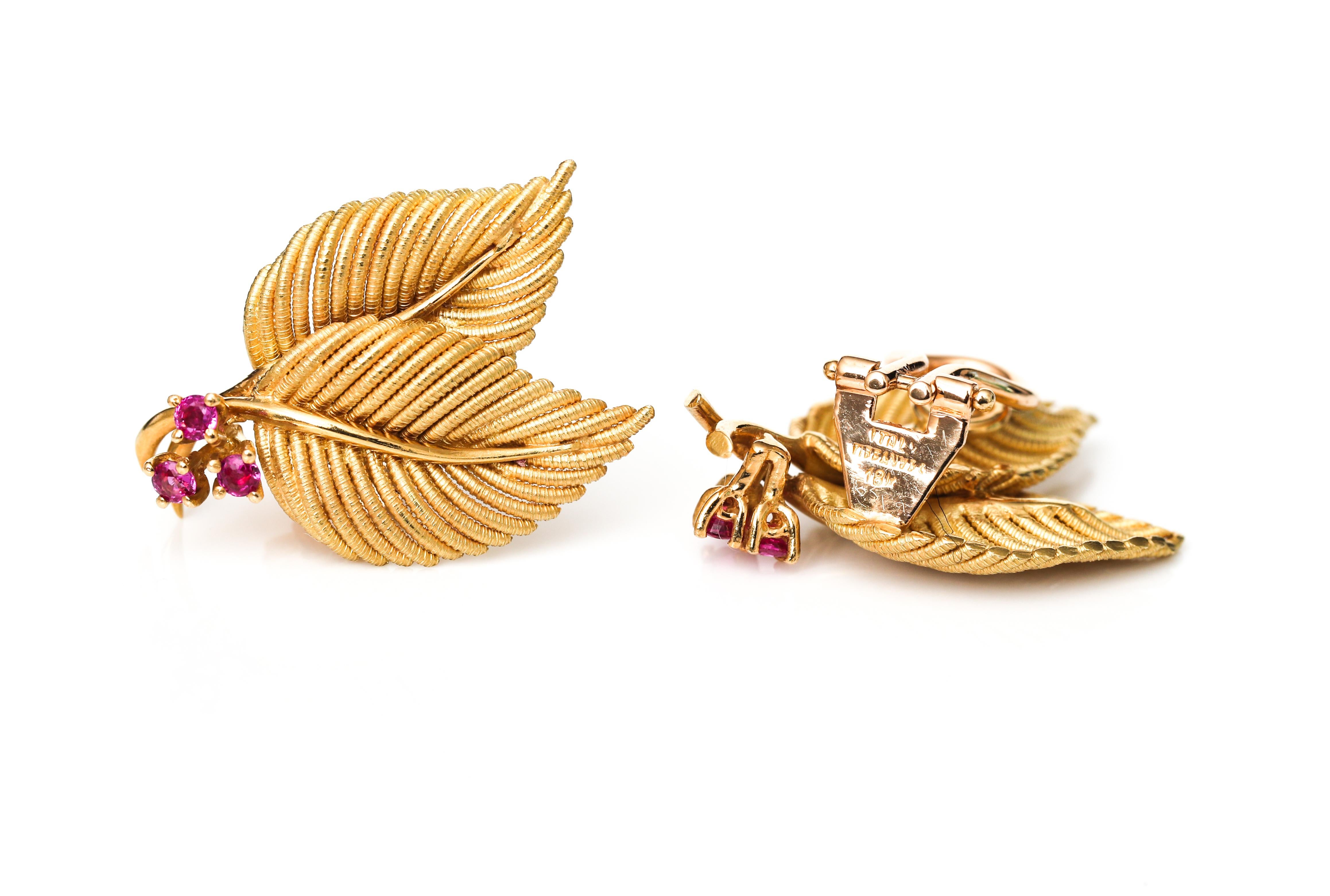 Gorgeous Tiffany & Co 'Leaf Motif' earrings from the 1950s. This beautiful earrings feature two petal leafs, with intricate detailing and accent rubies. The earrings are crafted in 18 karat yellow gold with a combination of high polish and matte