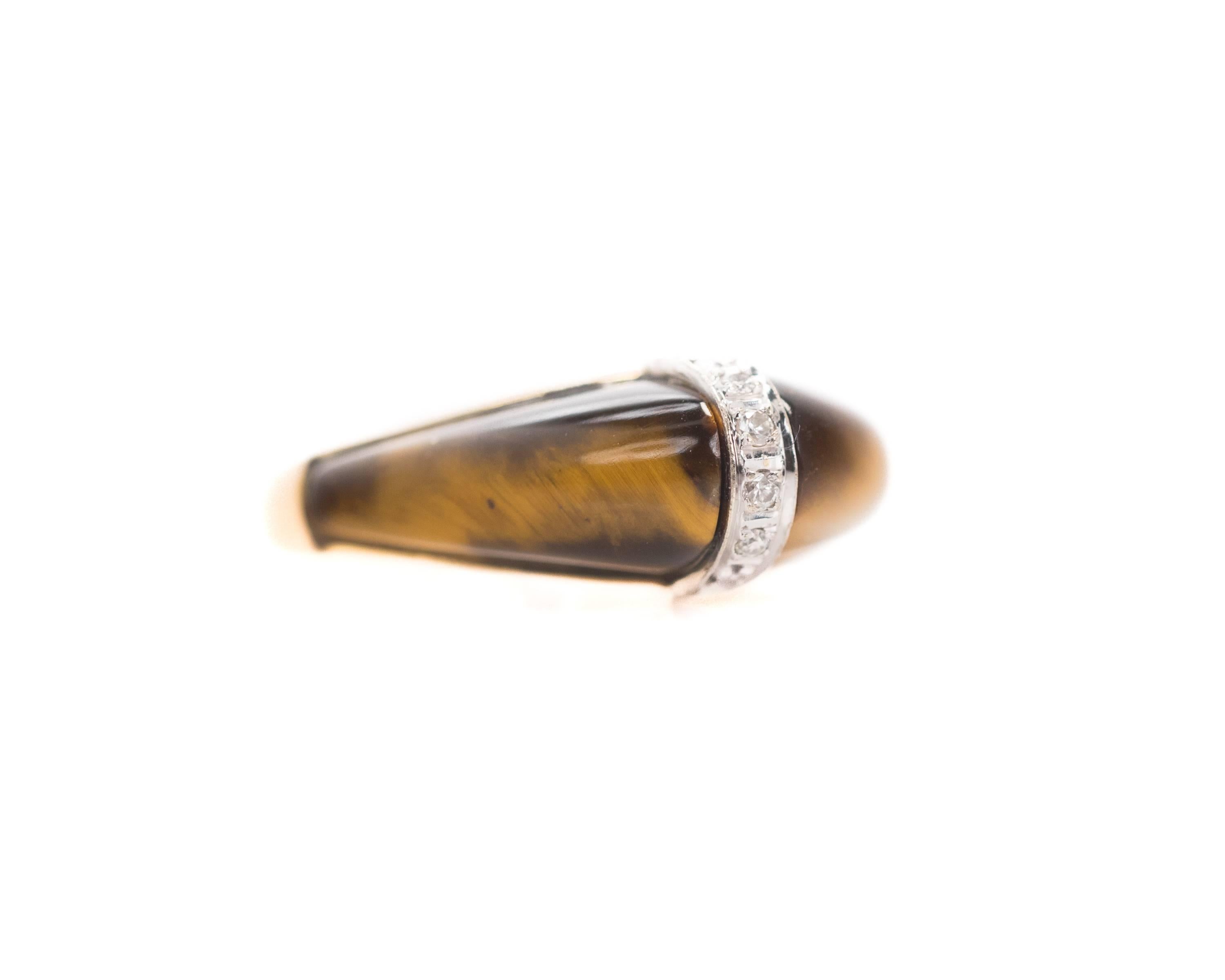 1950s Dome Ring - 14K Yellow Gold, Diamonds, Tiger's Eye

Features a peaked dome of Tiger's Eye with Diamonds. The front half of the ring is set with brown and gold Tiger's Eye. A vertical strip of Round Brilliant Diamonds runs through the center.