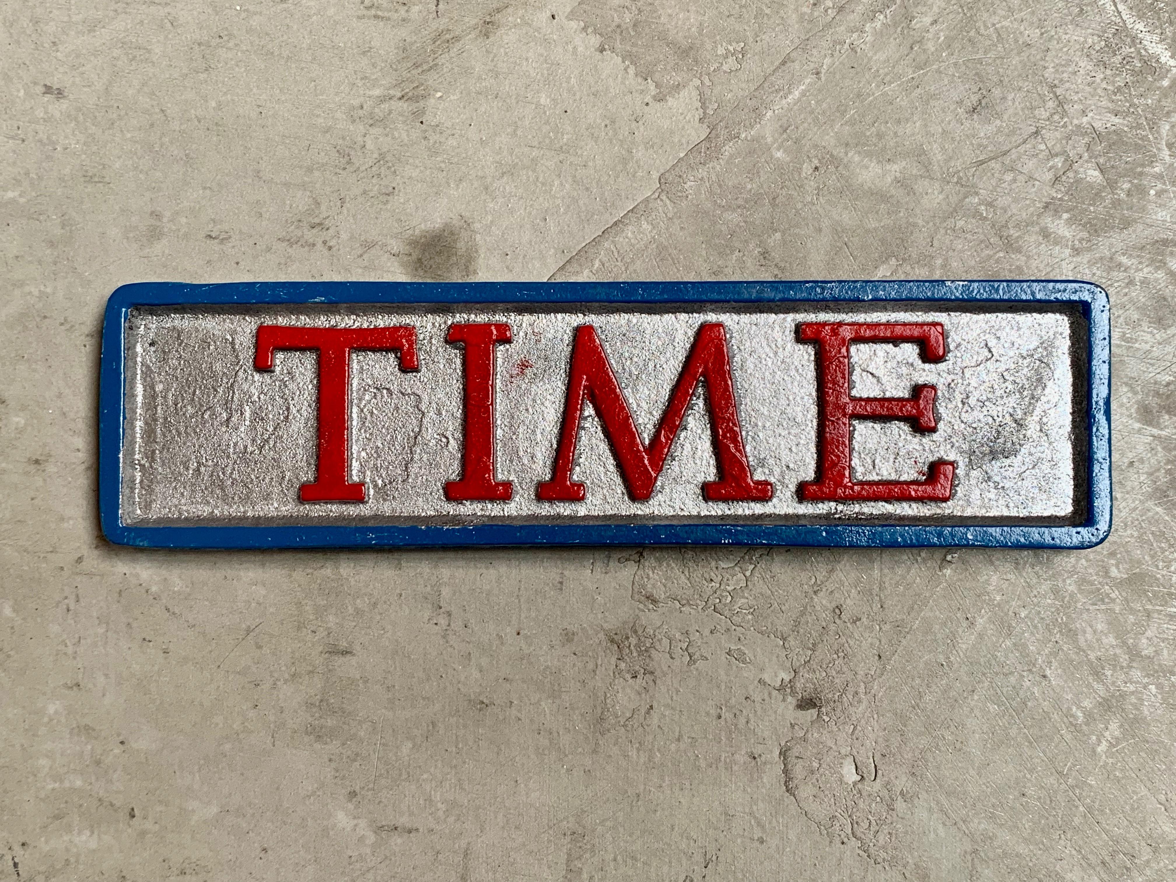 Hand painted metal paperweight depicting the word TIME. Believe these were used to hold down magazines at the newsstand. Great condition, some overpaint in some areas. Cool tabletop object.