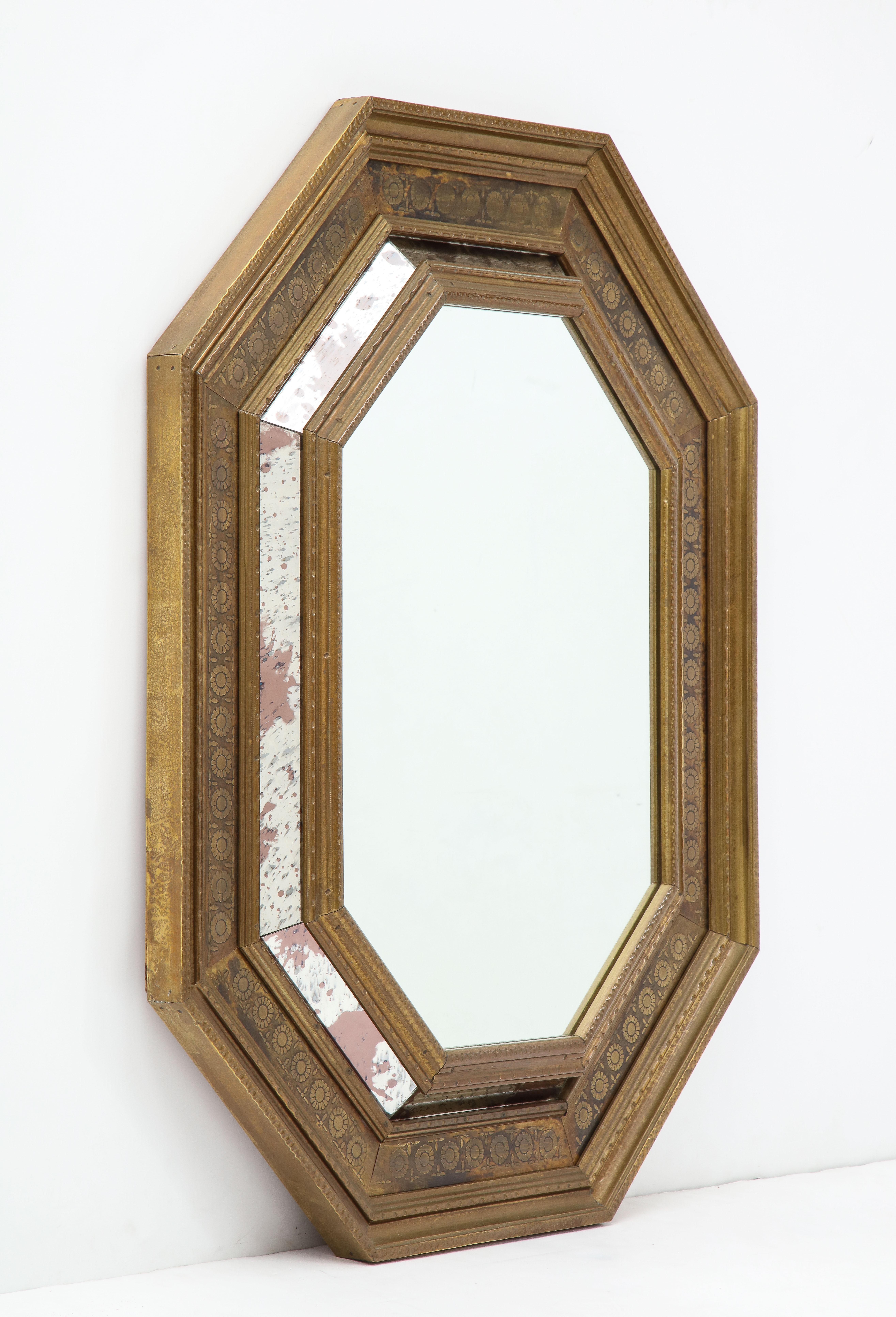 Stunning 1950s octagonal mirror wrapped in tin brass, with antique mirror detail label “Made in Spain”.
