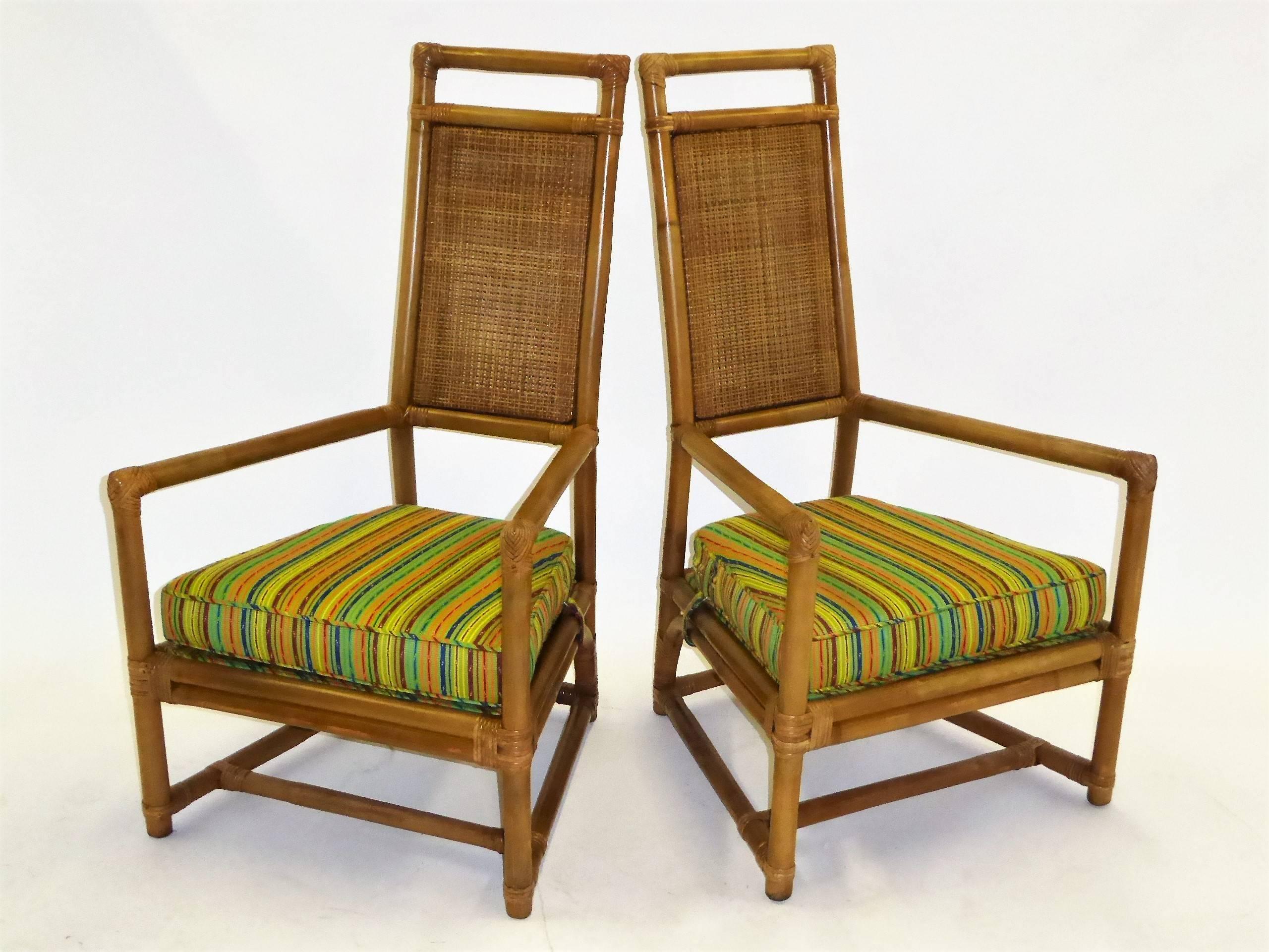 REDUCED FROM $5,850....From the Pavilion collection for Willow and Reed, Inc., a pair of  Henry Olko armchairs. A 1950s design in rattan and cane with throne chair regal aspirations with high backs and wide arms. Outstanding creation with Willow and