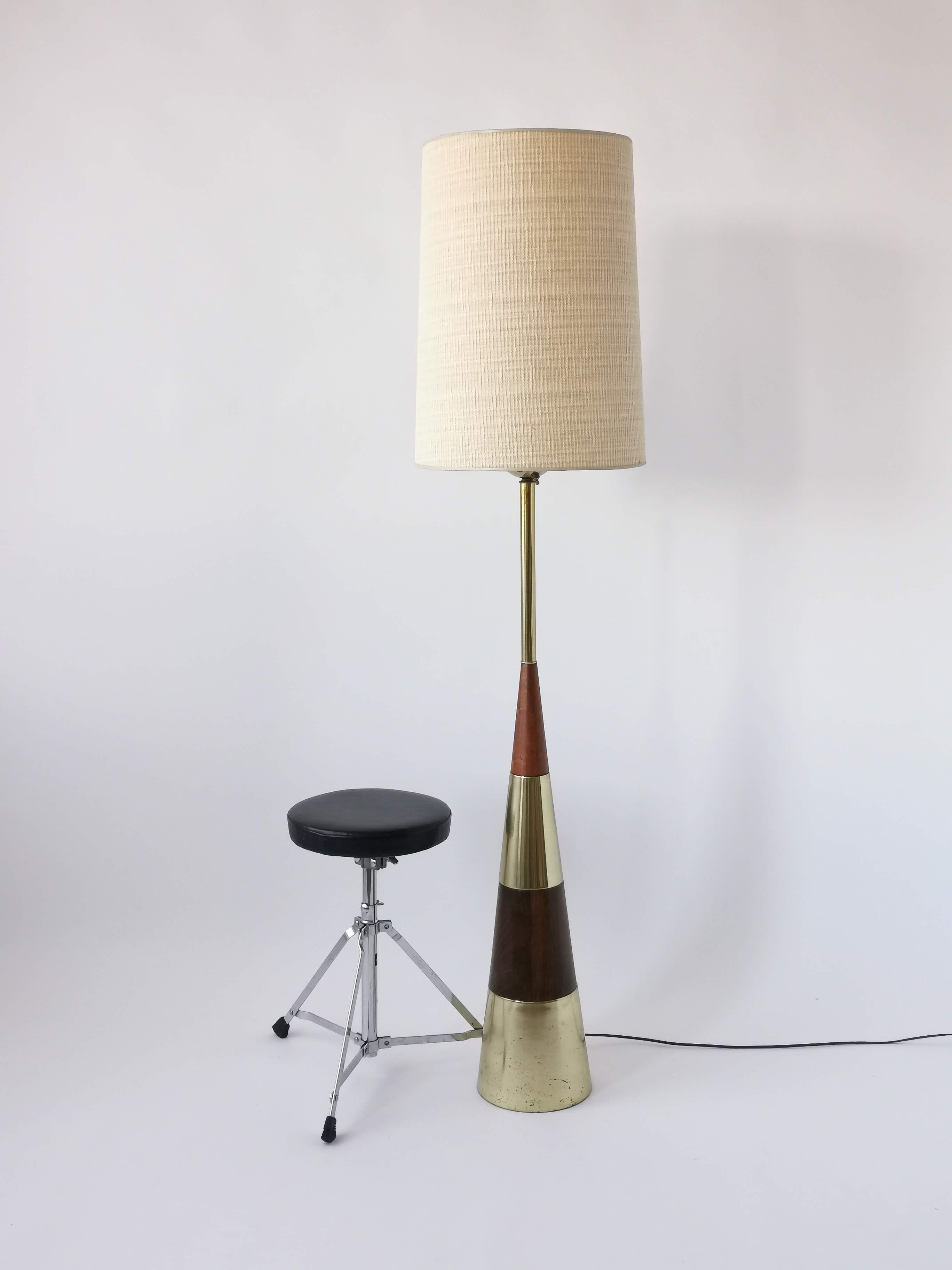 Rare massive floor lamp from Tony Paul made of thick brass and solid walnut.

Well made sturdy construction.

Contain 3 E26 size socket rated at 60 watt max each.

Rotating ON/OFF click switch control one, two or three-light.

Shade is not