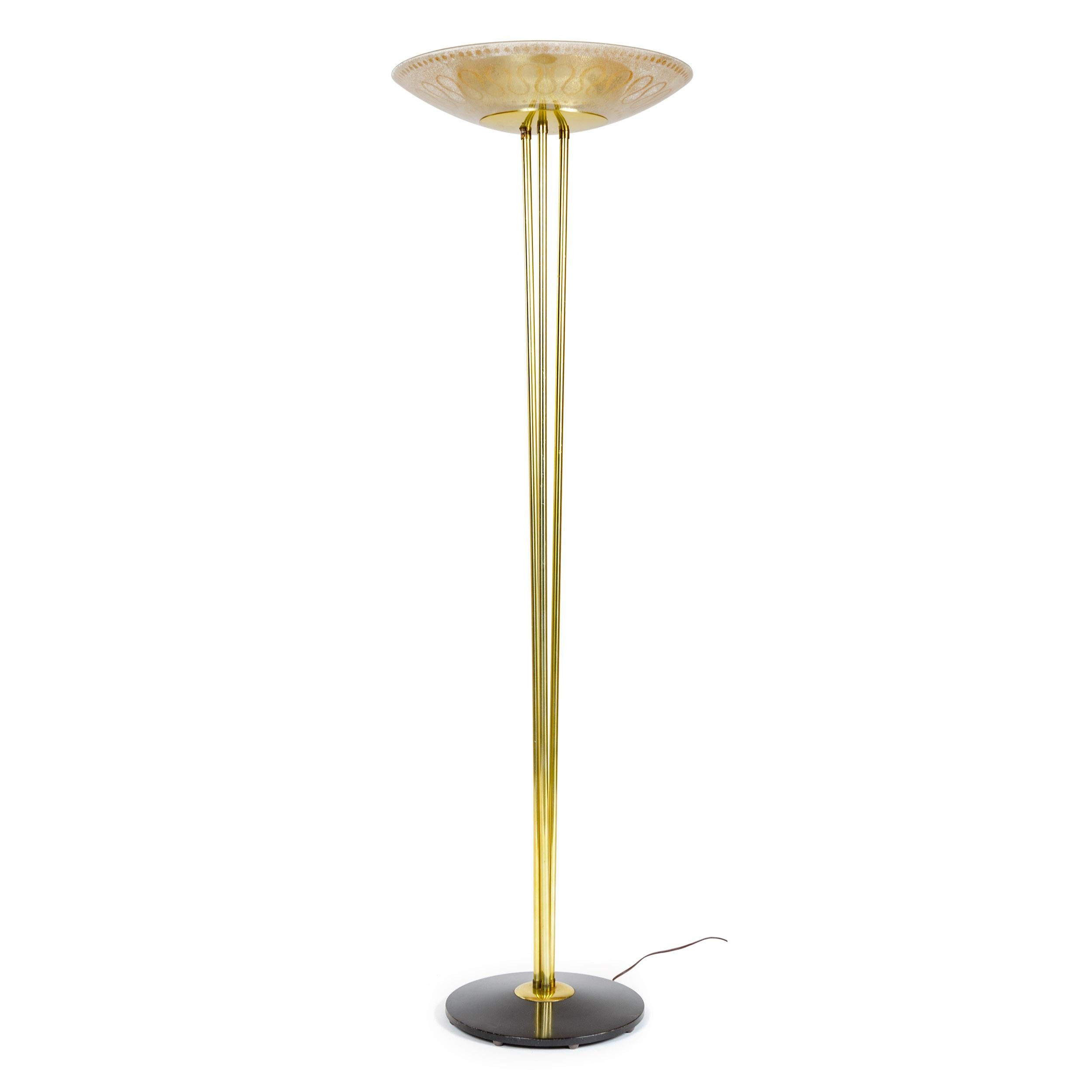 Classic uplight torchère floor lamp with three vertical brass rods supporting a shallow brass bowl and wider glass shade. The base designed by Gerald Thurston with a textured, fire annealed enameled glass shade designed by Carl Moser from his