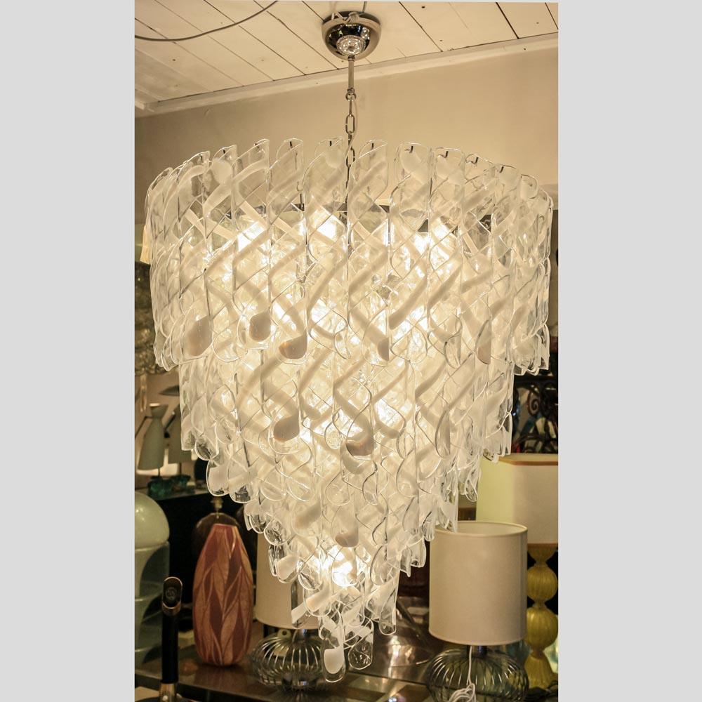 1950s Torciglione blown Murano glass clear and white components ceiling light   

This stunning and elegant pendent light is a perfect example of the magic of MURANO's art or glass making. The 