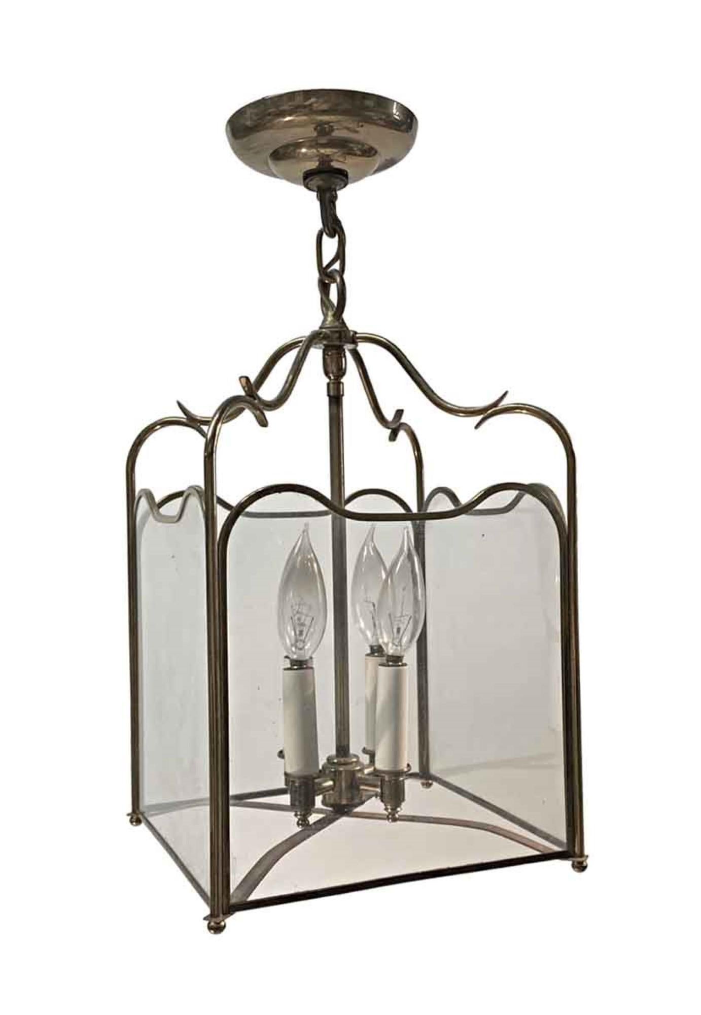 Traditional style 1950s polished brass and clear glass foyer light. Featuring four candelabra bulbs at 60 watts each max. This can be viewed at our Scranton, Pennsylvania location. Please inquire for the exact address.
