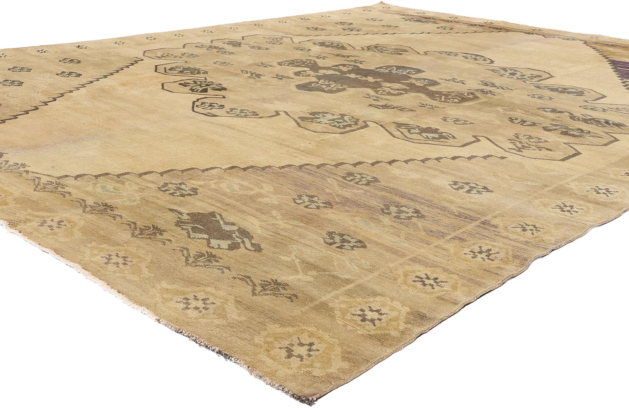 51372 Vintage Turkish Oushak Rug, 10'05 x 12'10. An extraordinary fusion of heritage and haute design, this hand-knotted wool vintage Turkish Oushak rug unveils a mesmerizing interplay of time-softened hues and enduring artistry. Drifting gracefully