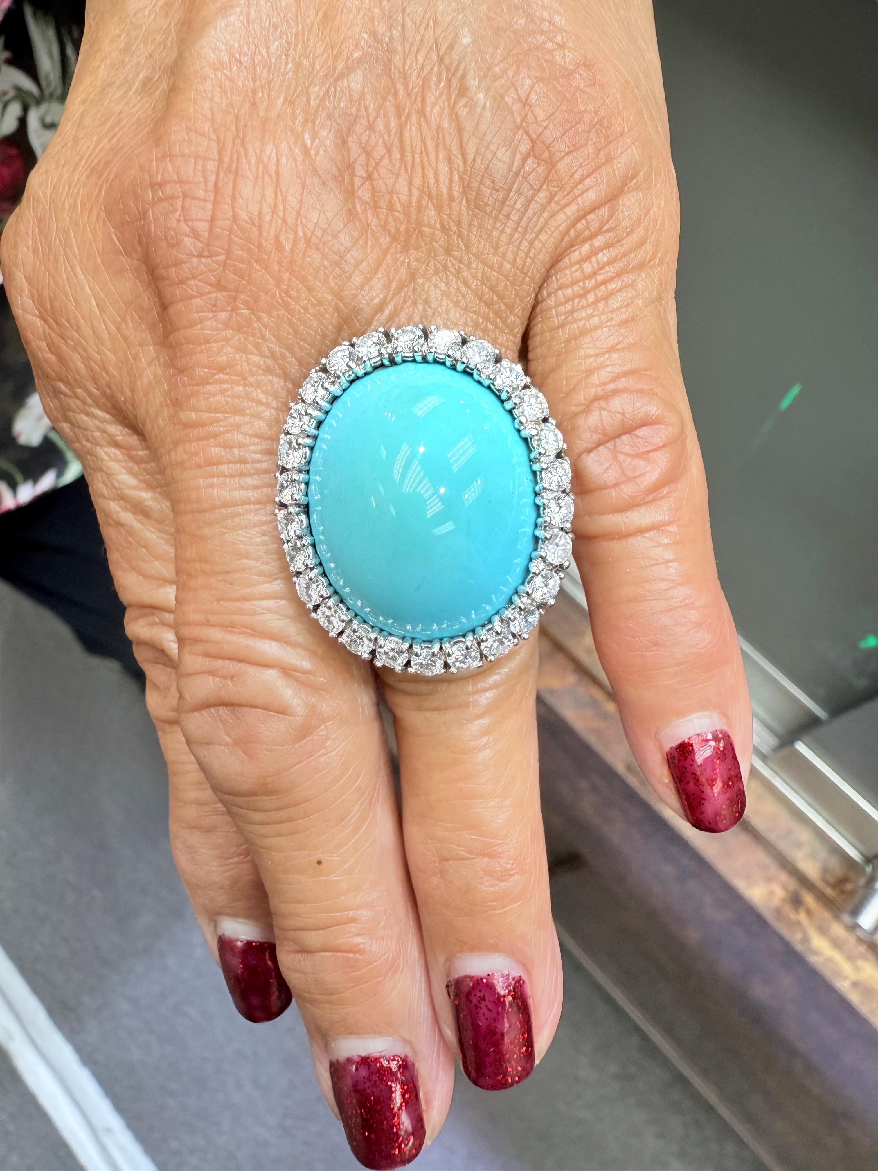 1950s Turquoise and Diamond 18k White Gold Cocktail Ring.

The Turquoise and Diamond 18k White Gold Cocktail Ring was made in the 1950s.  This substantial ring is set with a  beautiful large oval cabochon Robin's Egg blue Turquoise stone surrounded
