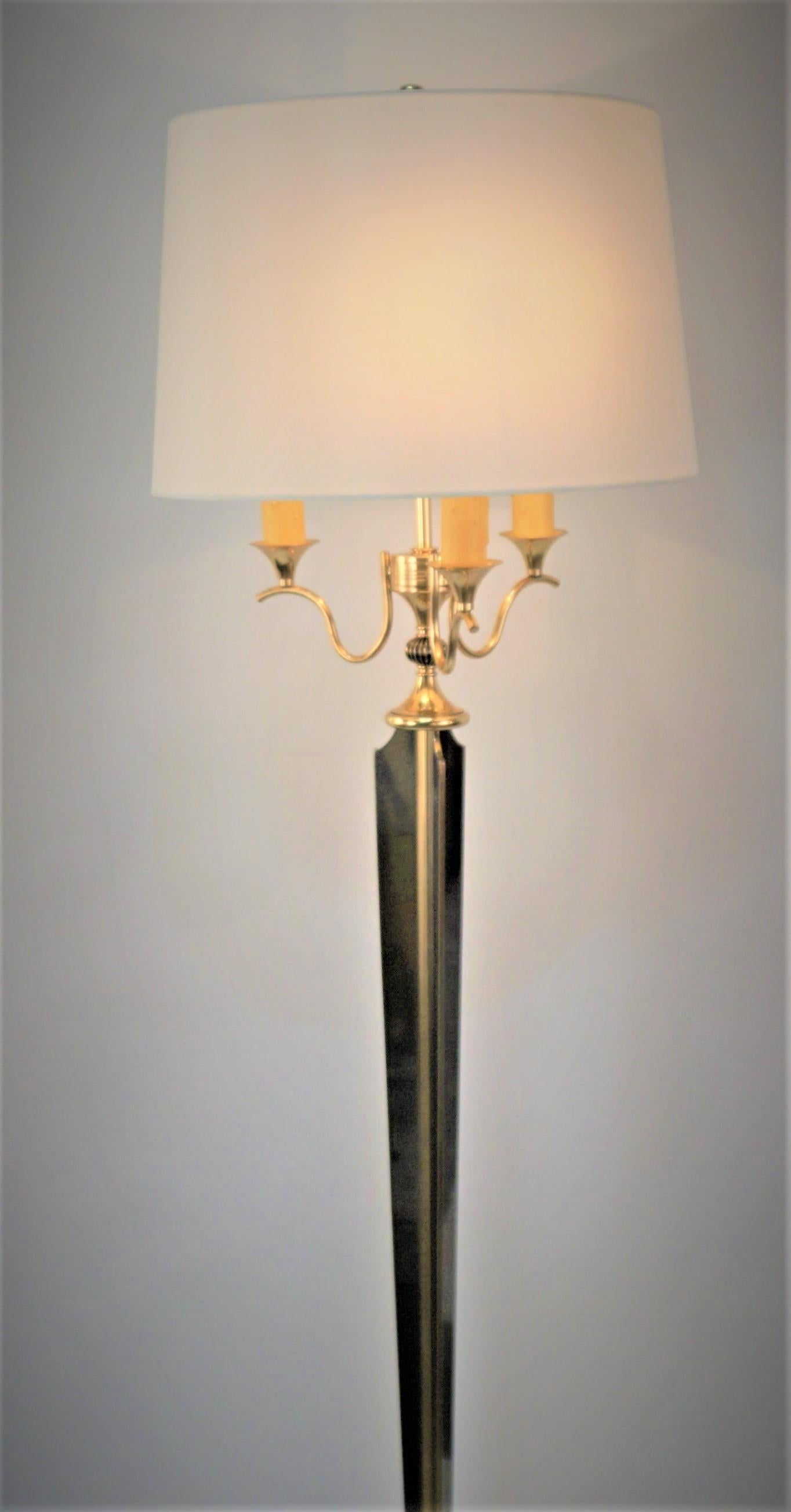 Elegant two-color bronze with three candlelight and fitted with hardback silk lampshade.
