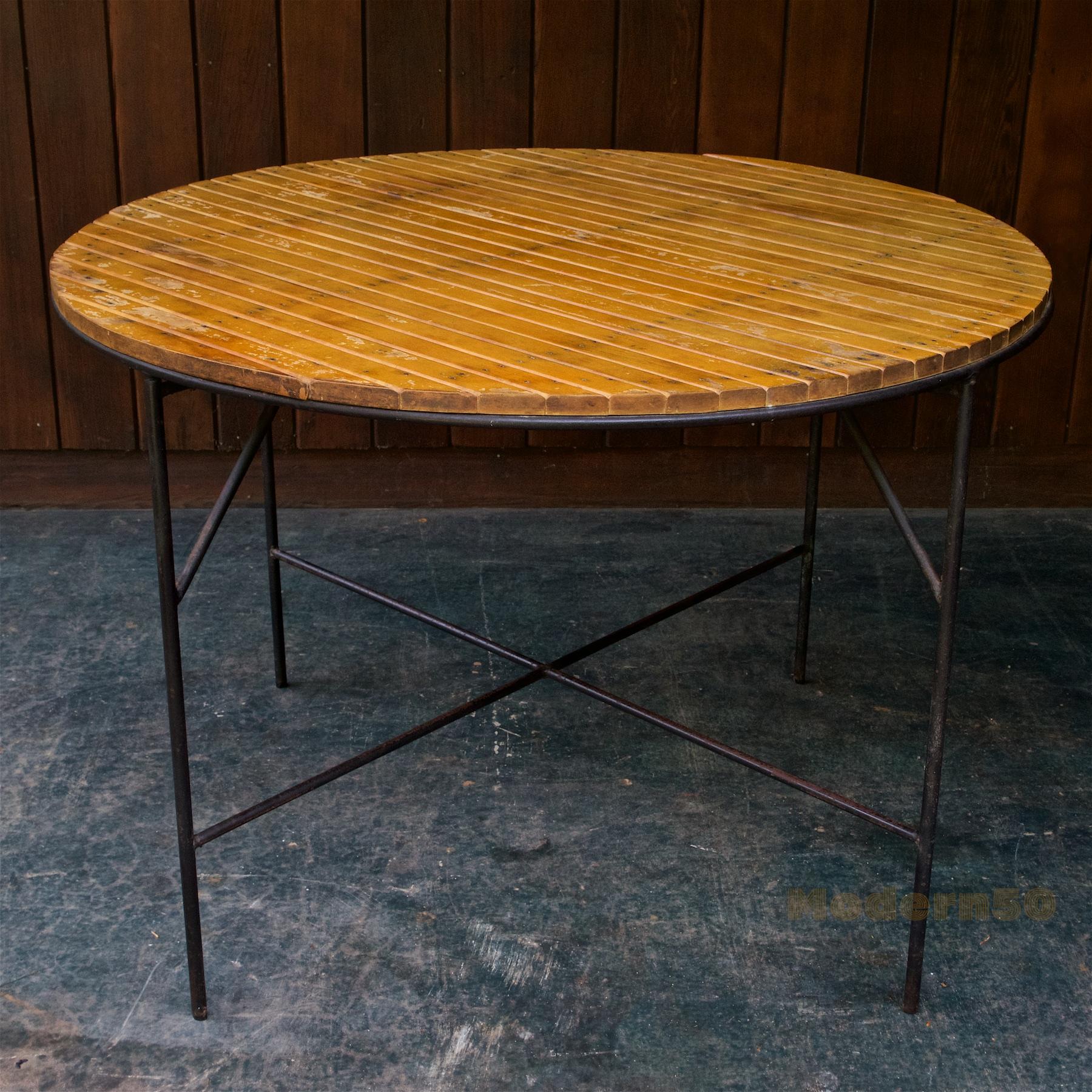 Place your perfect chair set around this patinated authentic 1950s California poolside table.