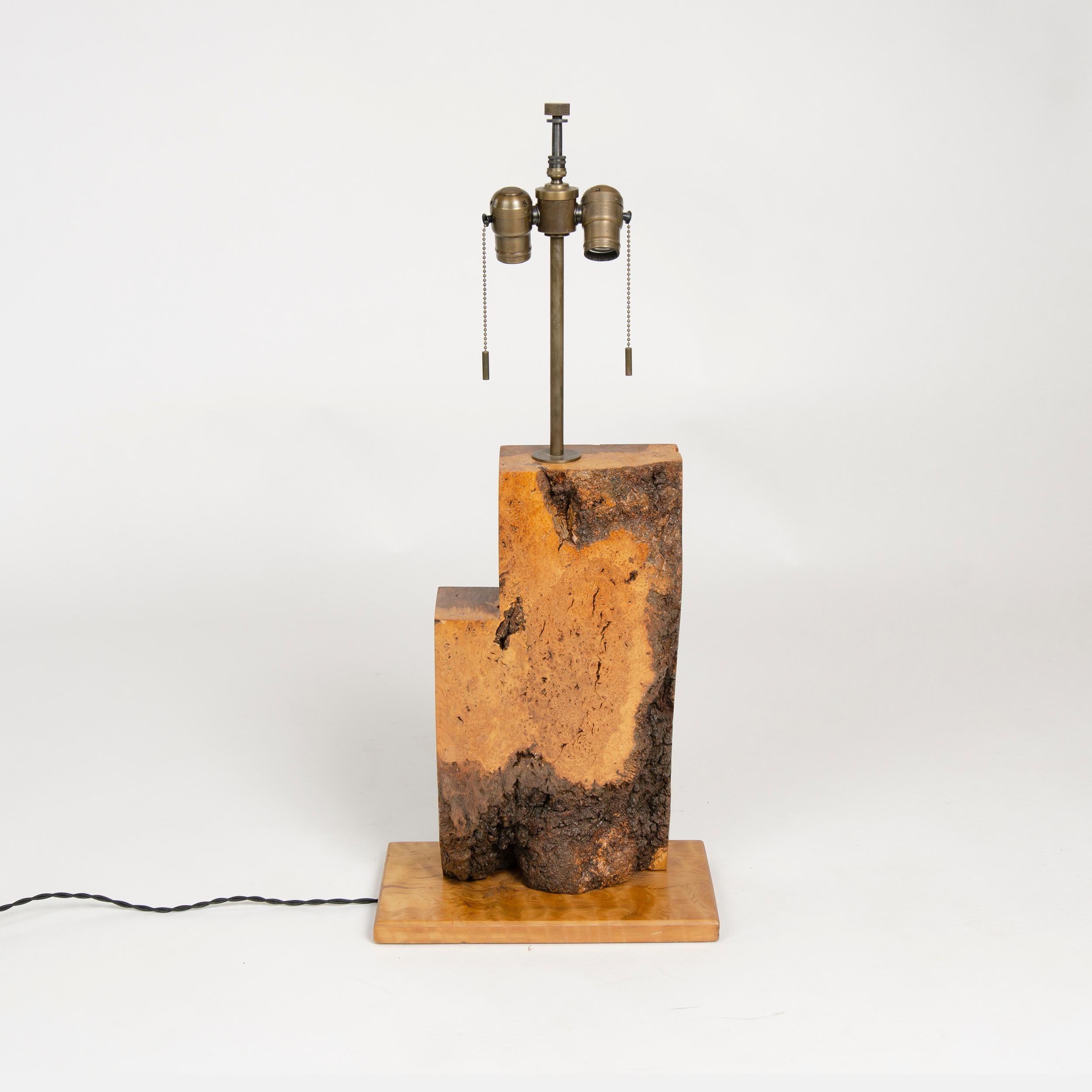An unattributed American Craftsman thick burled wood slab table lamp with rectangular base. 
Shade not included.