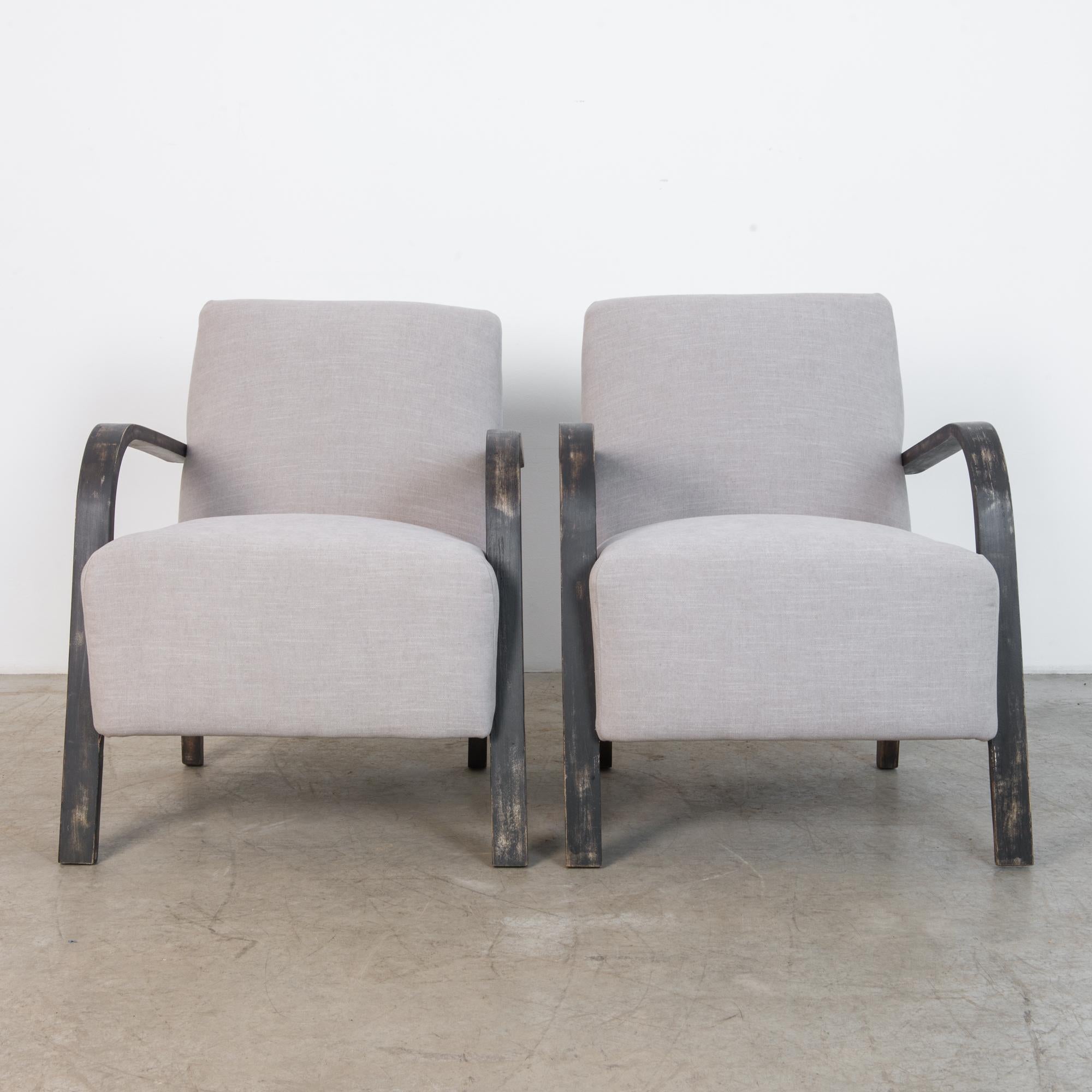 A Classic mid-20th century Czech design, circa 1950. A simple and elegant geometry contrasts the soft and comfortable seat with geometric bentwood element, in striking black and grey. Borrowing the vocabulary of modernism, central European designers