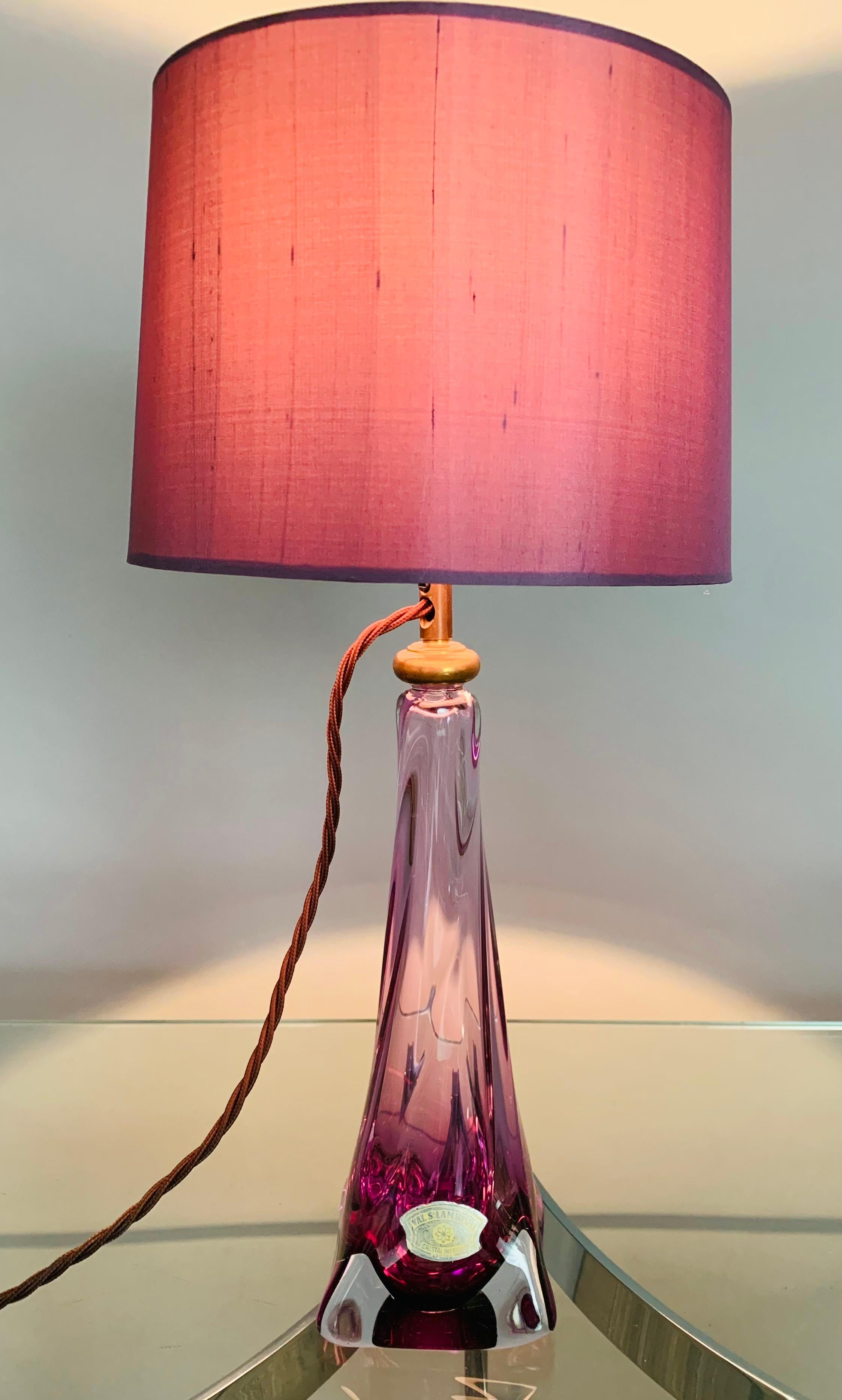 1950s Belgium Val St. Lambert, hand blown, purple and clear crystal glass, tapering, swirled, table lamp which includes a new purple silk shade. The lamp is a striking deep purple towards the base becoming clearer towards the top. Each corner of the