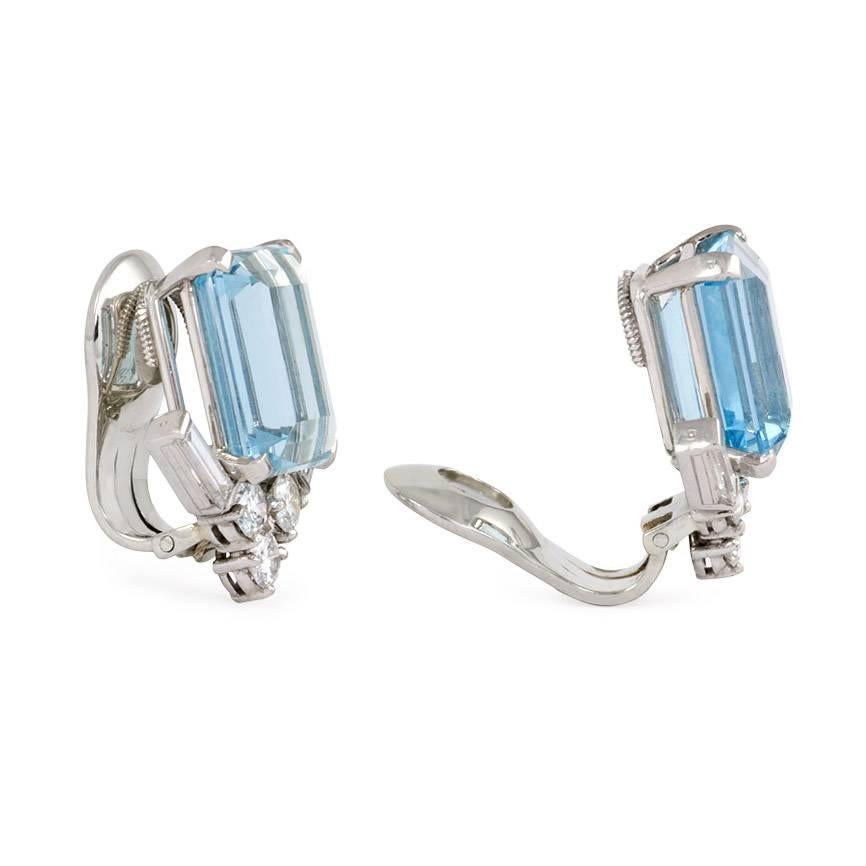 A pair of aquamarine and diamond clip earrings designed as a step-cut aquamarine atop a round and baguette diamond chevron motif, in platinum.  Van Cleef & Arpels, NY, #19079 S.O. (Special order). Aquamarines approx. 6.31, 6.15 ct.; atw. 1.68 ct.