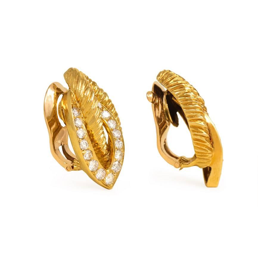 A pair of ropetwist gold and diamond clip earrings in the form of stylized entwined leaves, in 18K.  Van Cleef & Arpels, France #B3104.  Atw 1.00 ct. diamonds.