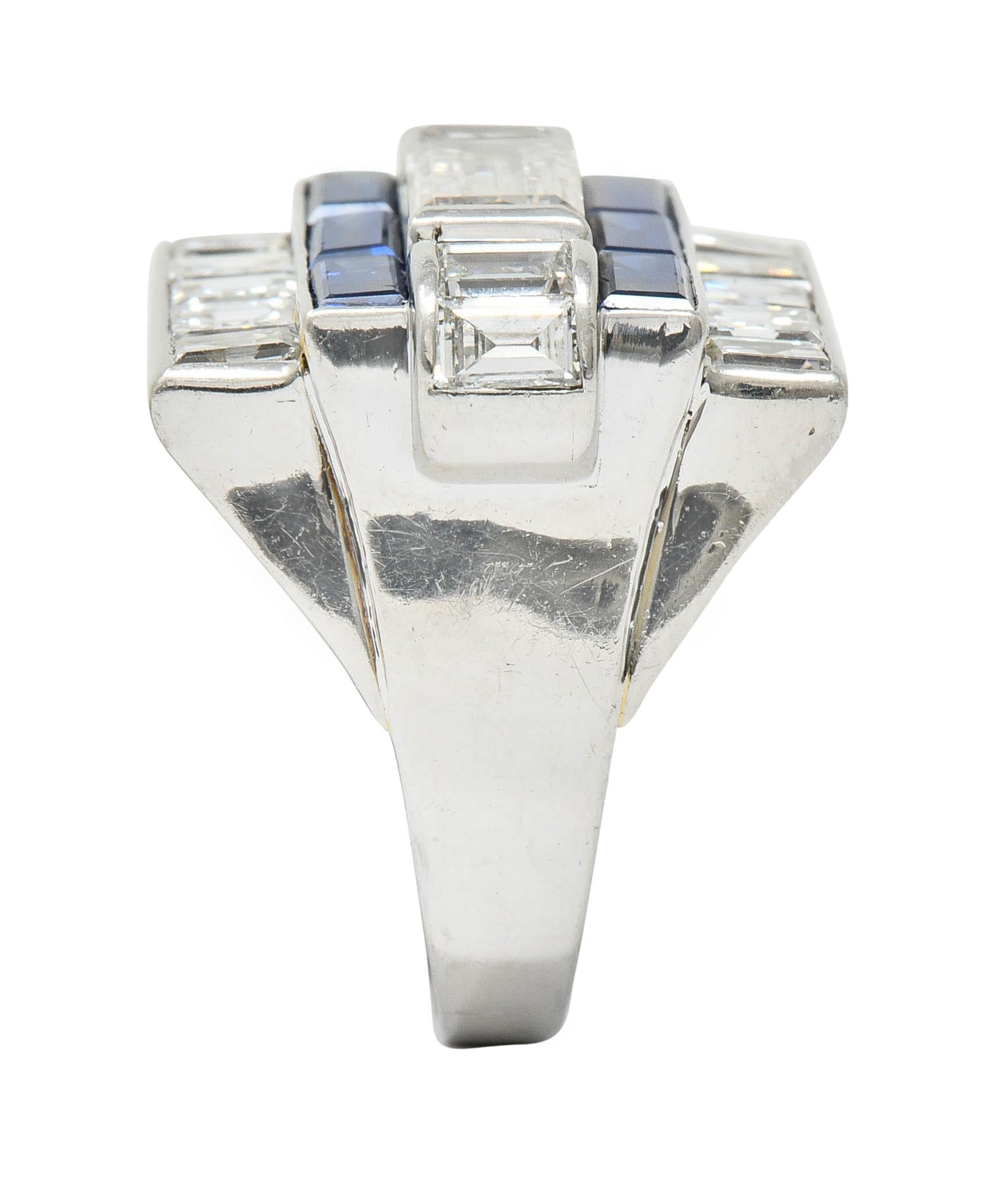 Rectangular ring is designed as geometric rows of sapphire and diamonds

Centering a rectangular step cut diamond weighing approximately 1.15 carat; F/G color and VS clarity

Flanked by scrolled shoulders, channel set with baguette cut diamonds