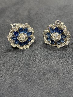 1950s Van Cleef & Arpels Platinum, Diamond and Sapphire Camelia Earrings
