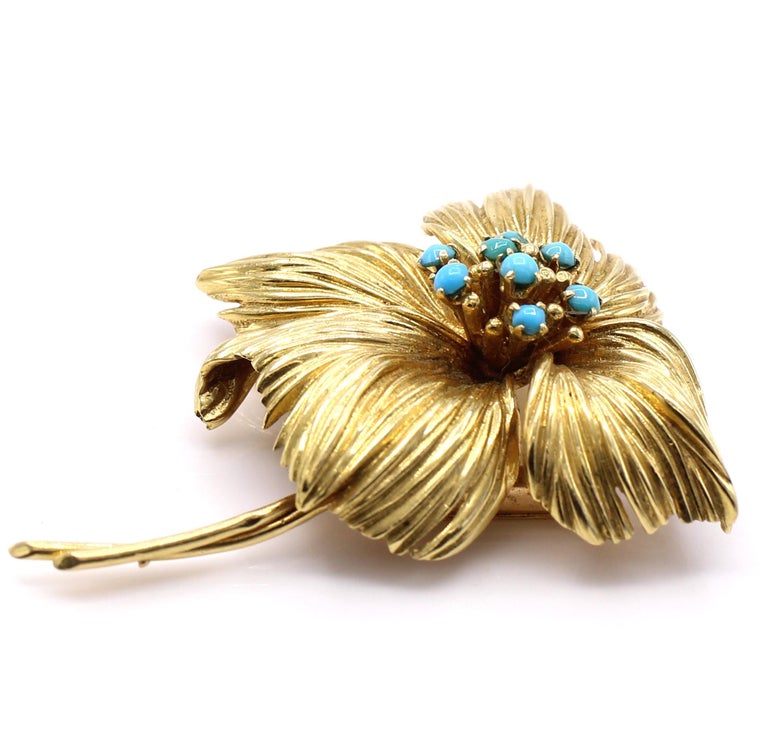 Beautifully designed and handcrafted textured 18 karat gold 1950s flower brooch set with turquoise. Signed Van Cleef & Arpels numbered with French assay marks and hallmarks