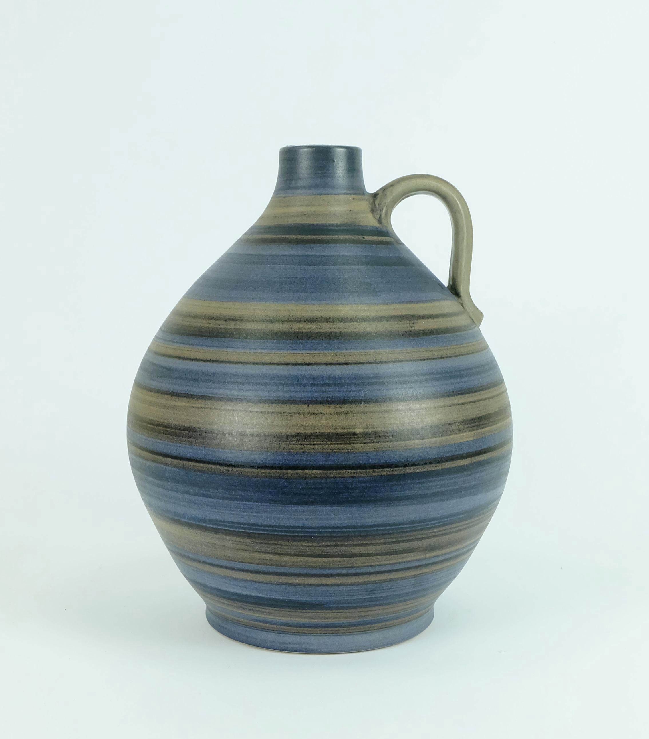 Big West German 1950s vase with stripe pattern in blue, brown and black. Marked to bottom 252/30. 
 
Height 11 4/5
