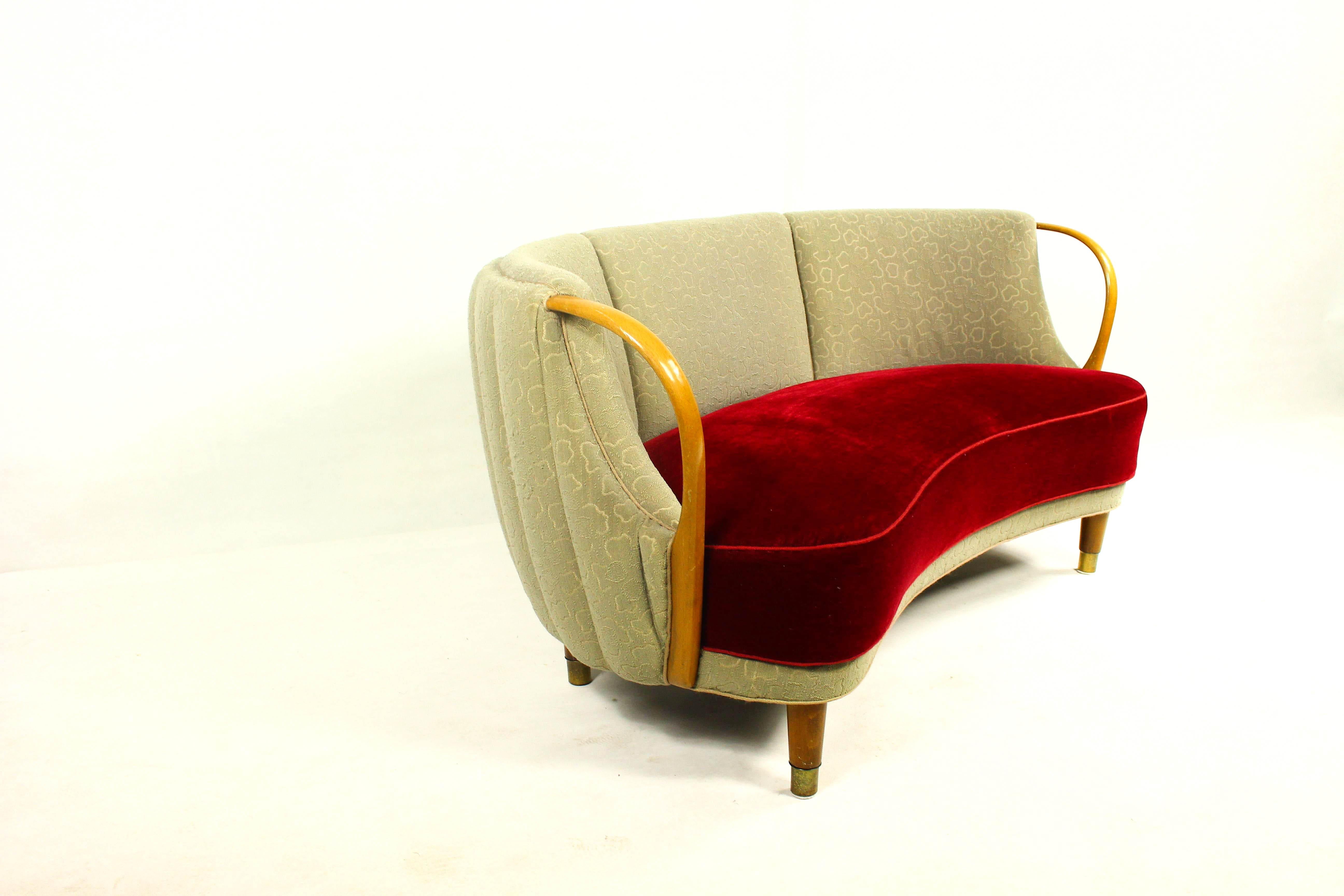 Unique curved or banana shaped loveseat or settee with open armrests designed and made as Model 96 by N.A. Jørgensens Møbelfabrik in 1954/55.

N.A. Jørgensen is better known under the name Bramin Mobler a name they adopted in the 1960s.