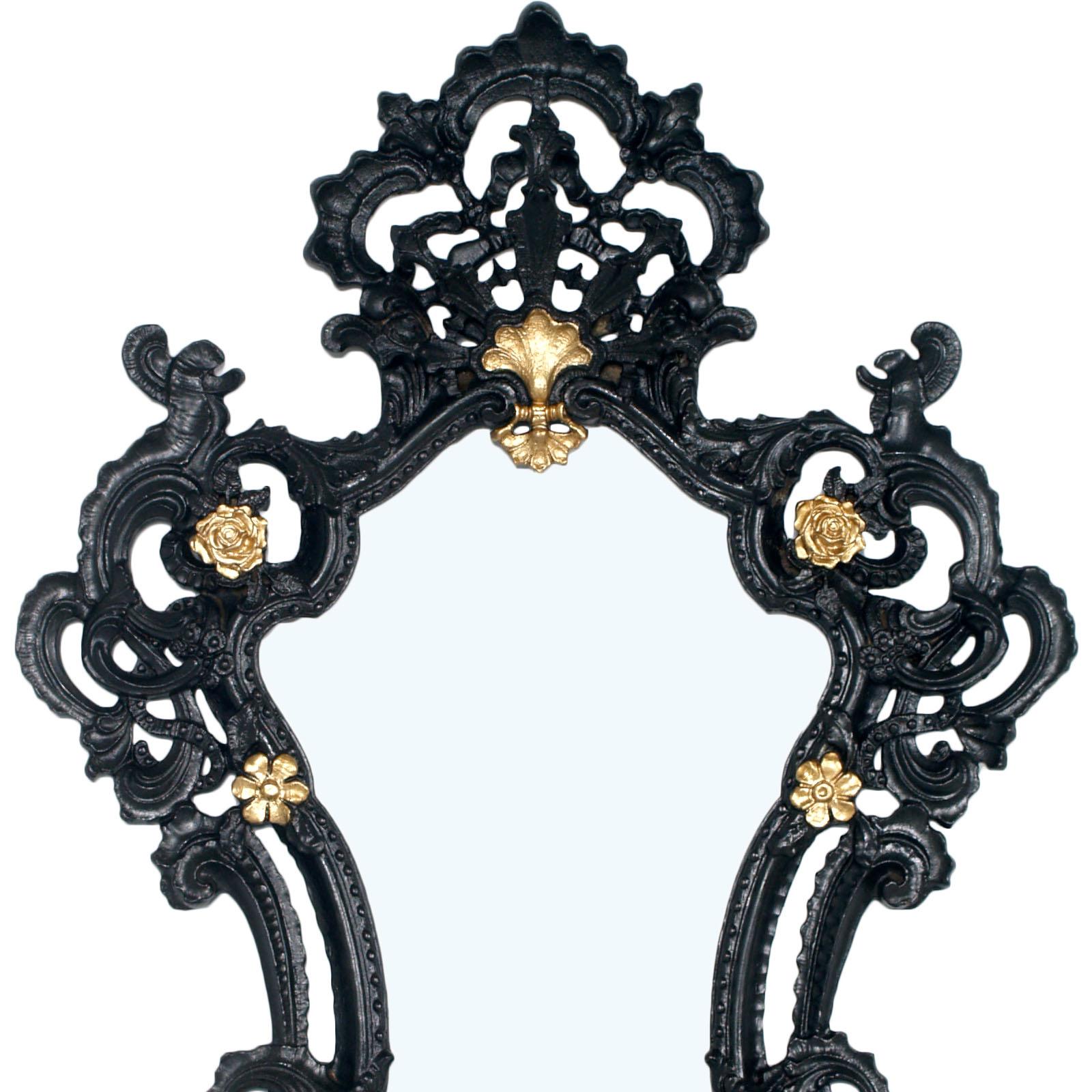 Very elegant midcentury Venetian Rococò style wall mirror in pressed carved wood black and gold laquered

Measures cm: H 102, W 70, D 10.