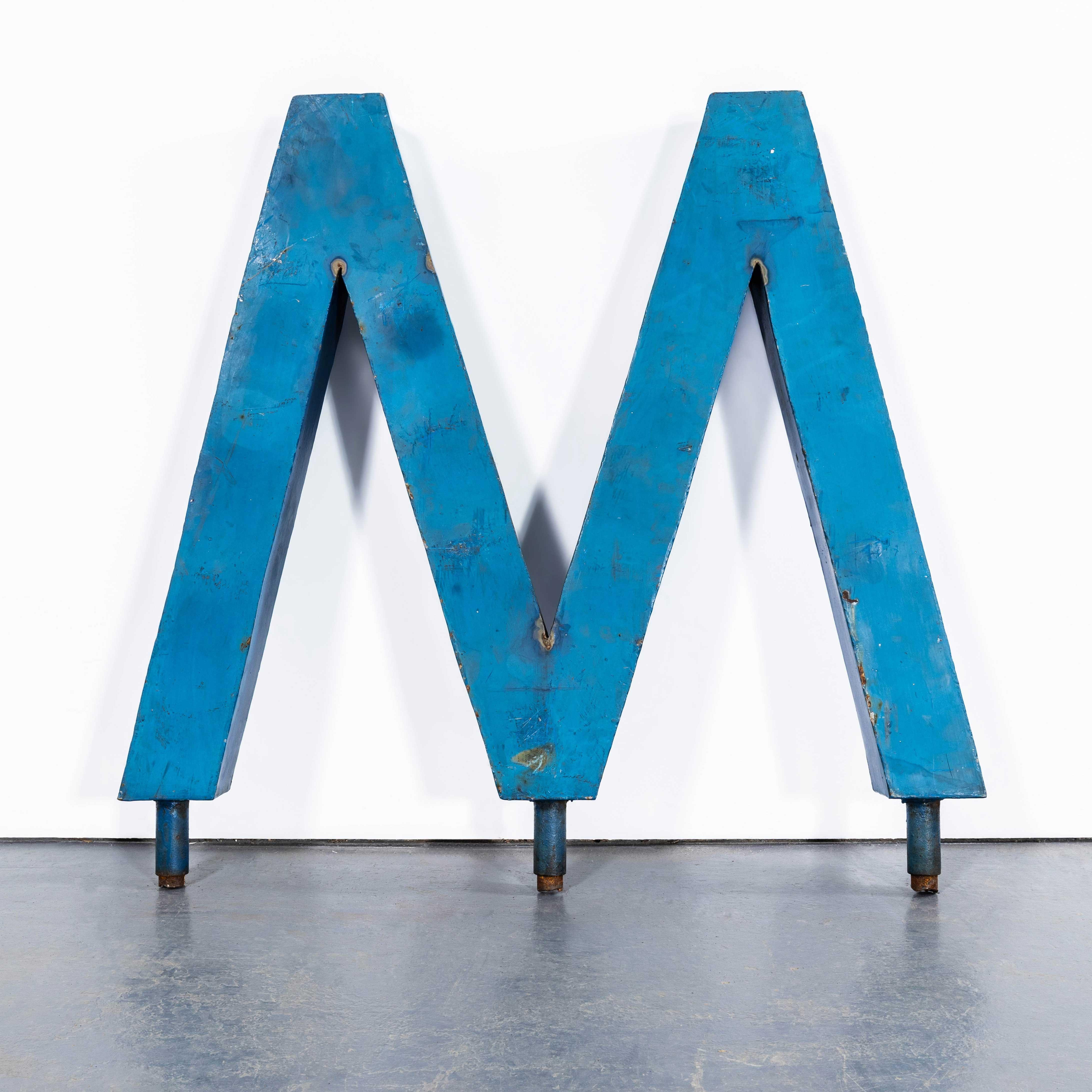 1950's Very Large Heavy Industrial Sign Letter - Blue M. 

Sourced in Belgium these are large heavy steel letters used as external signage. Approximate weight 25kg. Listing is for the one letter as photographed.

Workshop Report:
Our workshop team