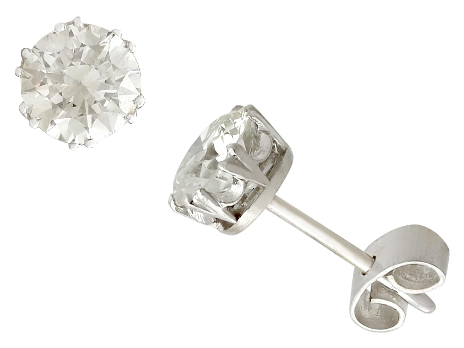 An impressive pair of vintage 2.39 carat diamond and platinum, 18 karat and 14 karat white gold stud earrings; part of our diverse diamond jewellery and estate jewelry collections.

These fine and impressive vintage diamond earrings have been
