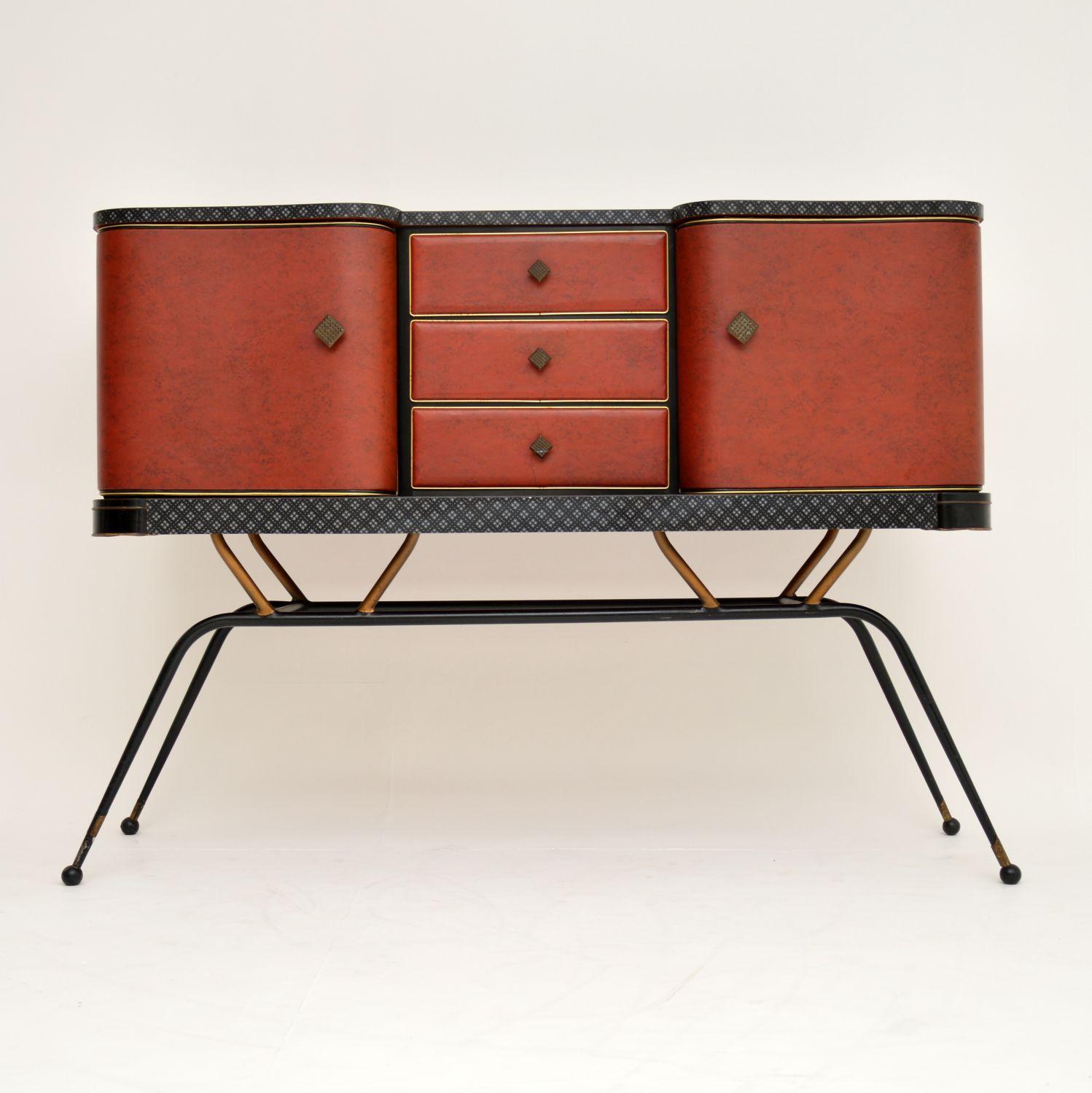 This is a fantastic original 1950s vintage sideboard, with a most unusual and stylish design. Made from an interesting combination of materials, this is of really high quality. The carcass is wood, with a Formica top and red vinyl wrapped