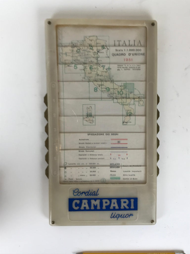 Rare and perfectly working Automatic Map of Italy advertising gift from Davide Campari Company in Milan.

Scale 1: 1,000,000. Year 1951. 

The map shows two advertising logos front and back: Bitter CAMPARI L'aperitivo (front), Cordial CAMPARI