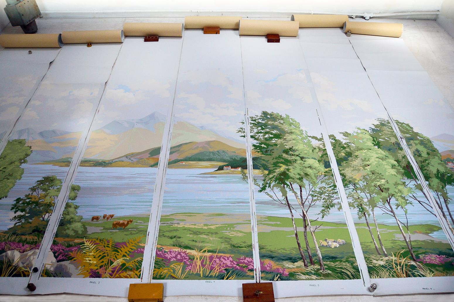 Stunning ‘Scottish Highlands’ block printed wallpaper by Arthur Sanderson & Sons. The scenic designs depict a Scottish landscape of misty mountains surrounding Loch Lomond, with cattle and typical lochside cottages over 7 panels all on a pale blue