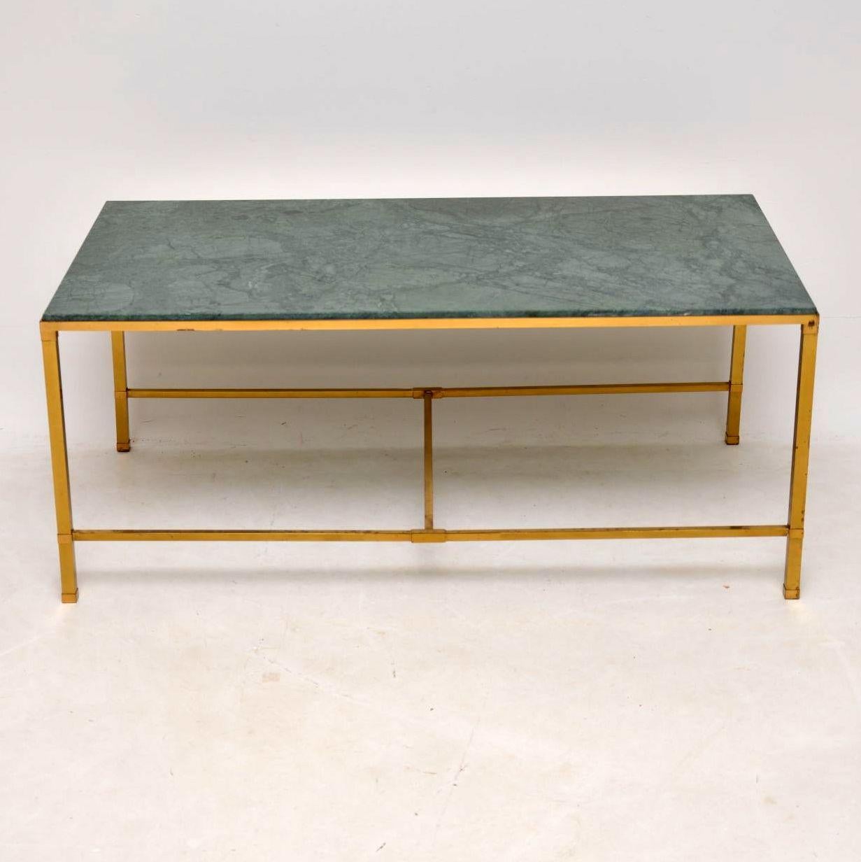 A stunning and quite large vintage coffee table with a brass frame and a beautiful green marble top. The brass frame is from the 1950s-1960s and is in very good condition; its great quality, structurally sound with no damage and nice patina. We have