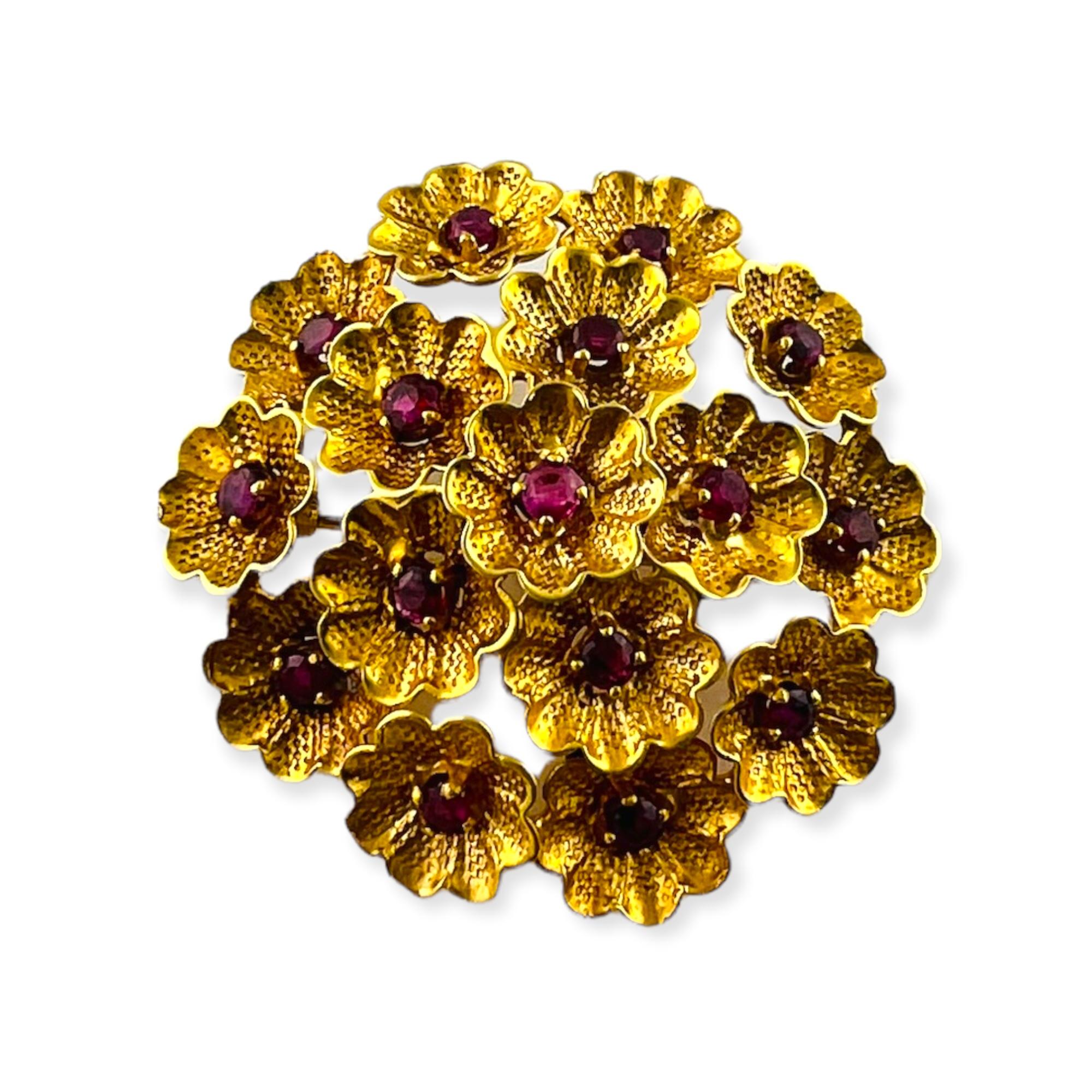 Vintage Cartier 18K Yellow Gold Ruby Flower Brooch

This beautiful 3D Cartier yellow gold brooch is a circular wreath of flowers with ruby centers

16 round rubies total approx. .80 cts.

Approx. 1.25