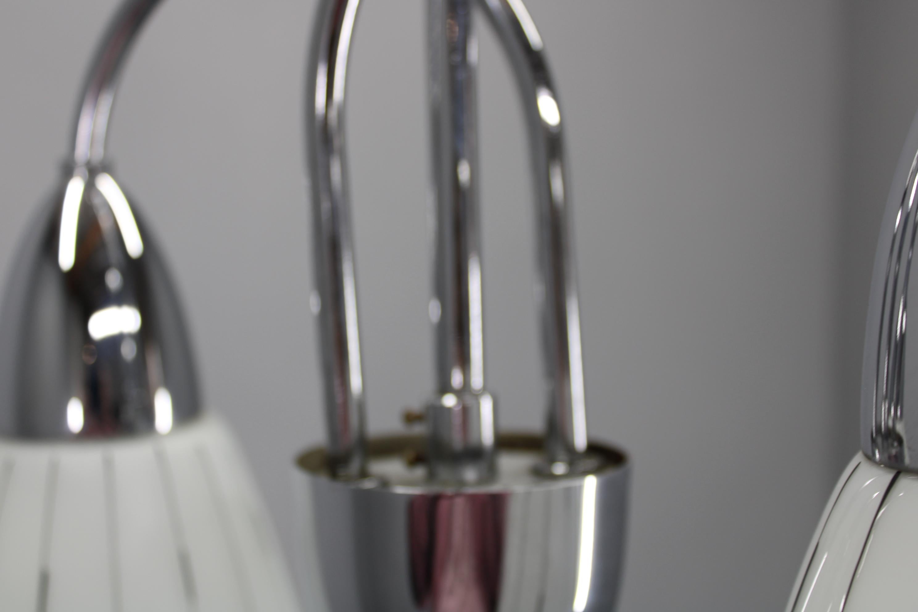Chandelier by Instala Decin, in the 1970's, in Czechoslovakia.
Made of chrome and glass.
Repolished, cleaned, shows minor signs of use, includes newly installed cabels.
Fully functional.
