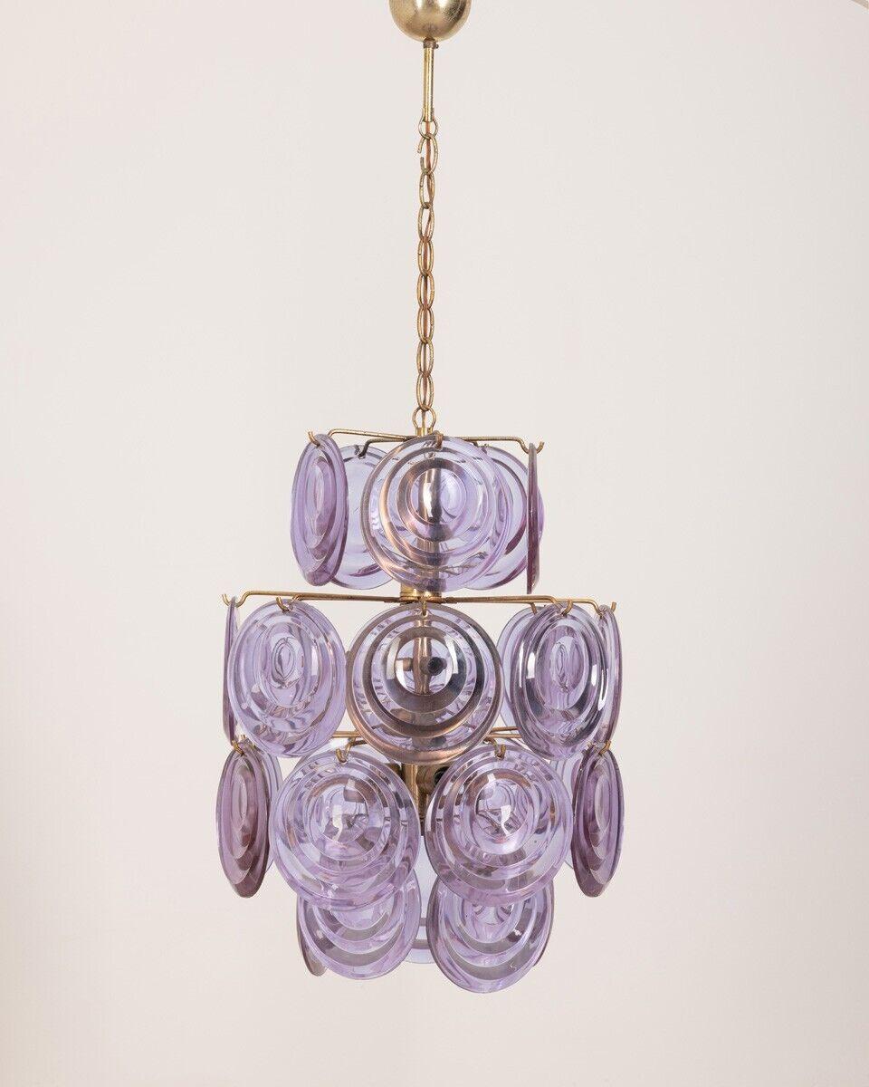 Six-light chandelier with purple Murano glass pendants, Vistosi design, 1950s.

CONDITION: In good condition, working, the pendants may have small defects.

DIMENSIONS: Height 96 cm; Diameter 42 cm

MATERIALS: Metal and Glass

YEAR OF
