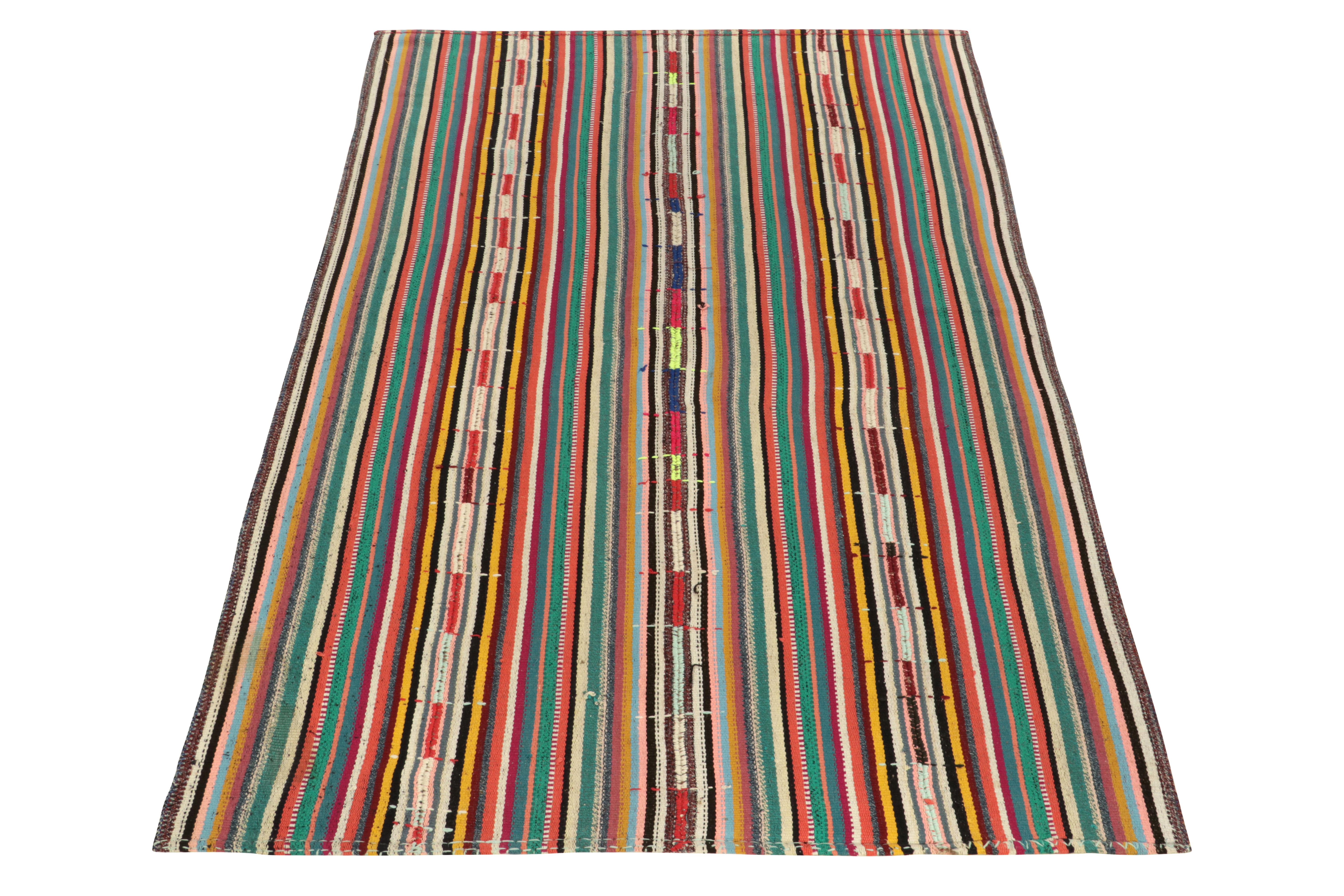 Originating from Turkey circa 1950-1960, a rare type of chaput kilim rug style now entering our Antique & Vintage selections. 

Characterized by fine detailing with the colors within the polychromatic stripes, the light & refreshing piece welcomes