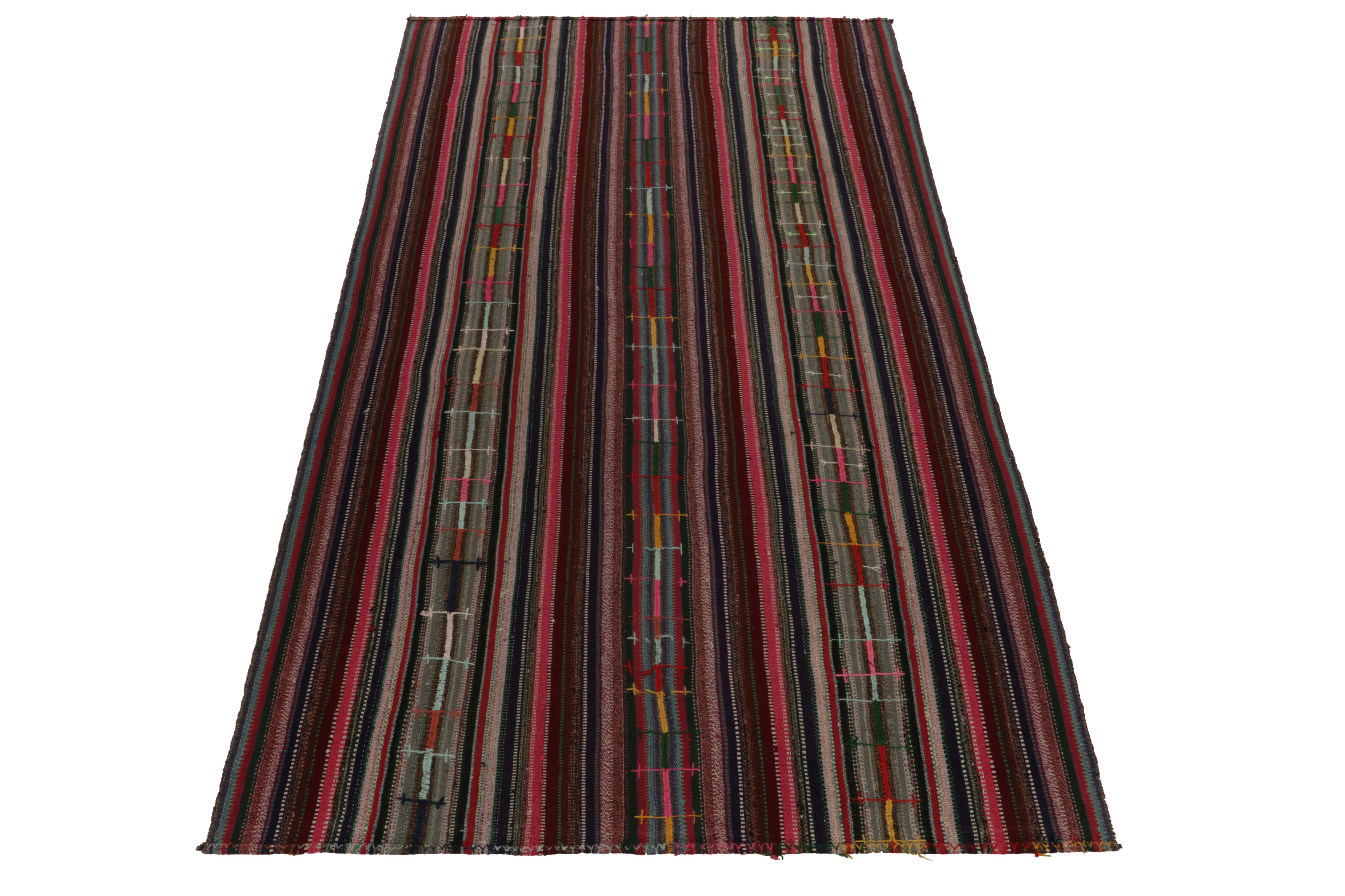 Originating from Turkey circa 1950-1960, a rare type of chaput kilim rug style now entering our Antique & Vintage selections. 

Characterized by fine detailing with the colors within the polychromatic stripes, the mature piece welcomes a departure