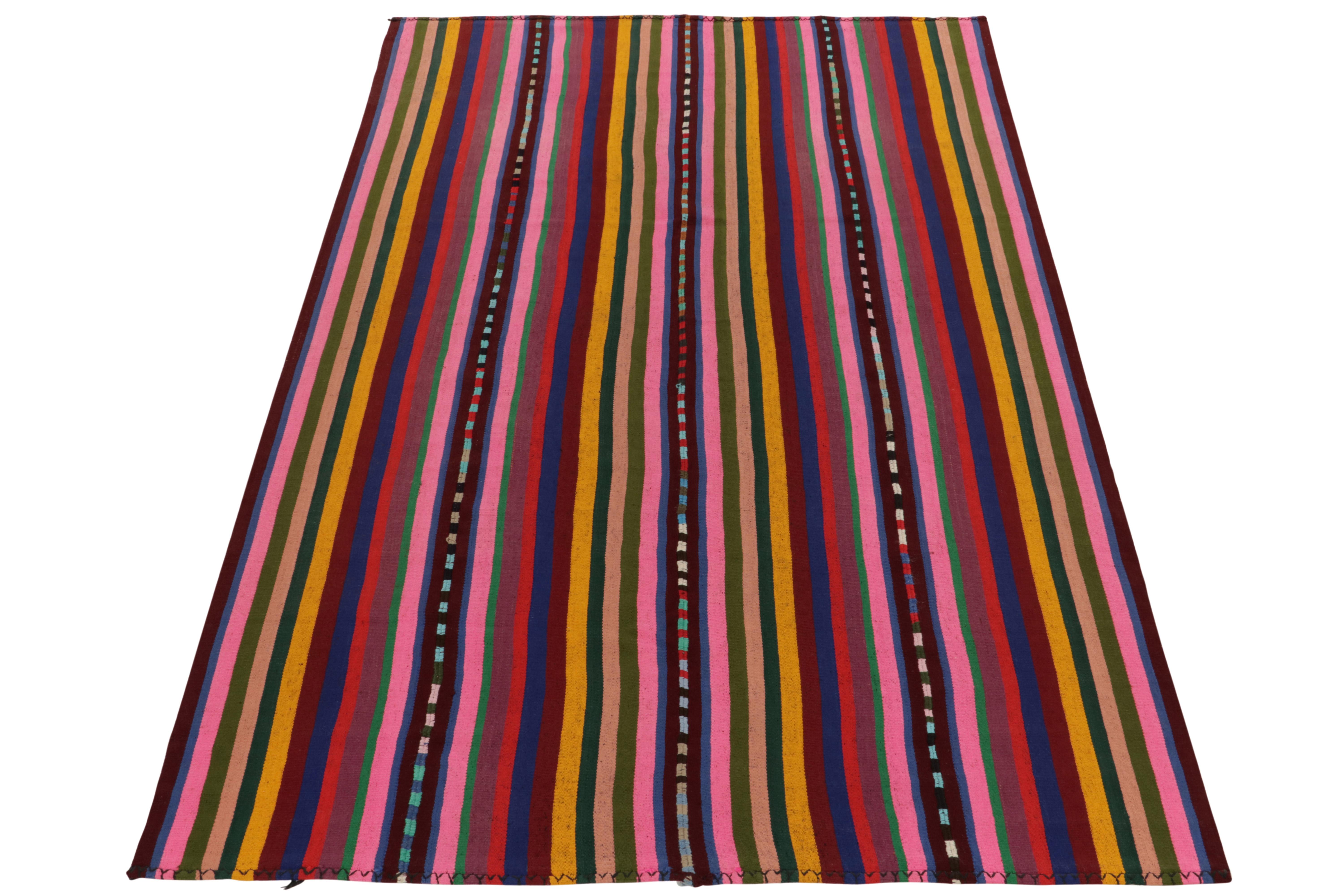 Originating from Turkey circa 1950-1960, a rare type of chaput kilim rug style now entering our Antique & Vintage selections. Characterized by fine detailing with the colors within the polychromatic stripes, the light & refreshing piece welcomes a