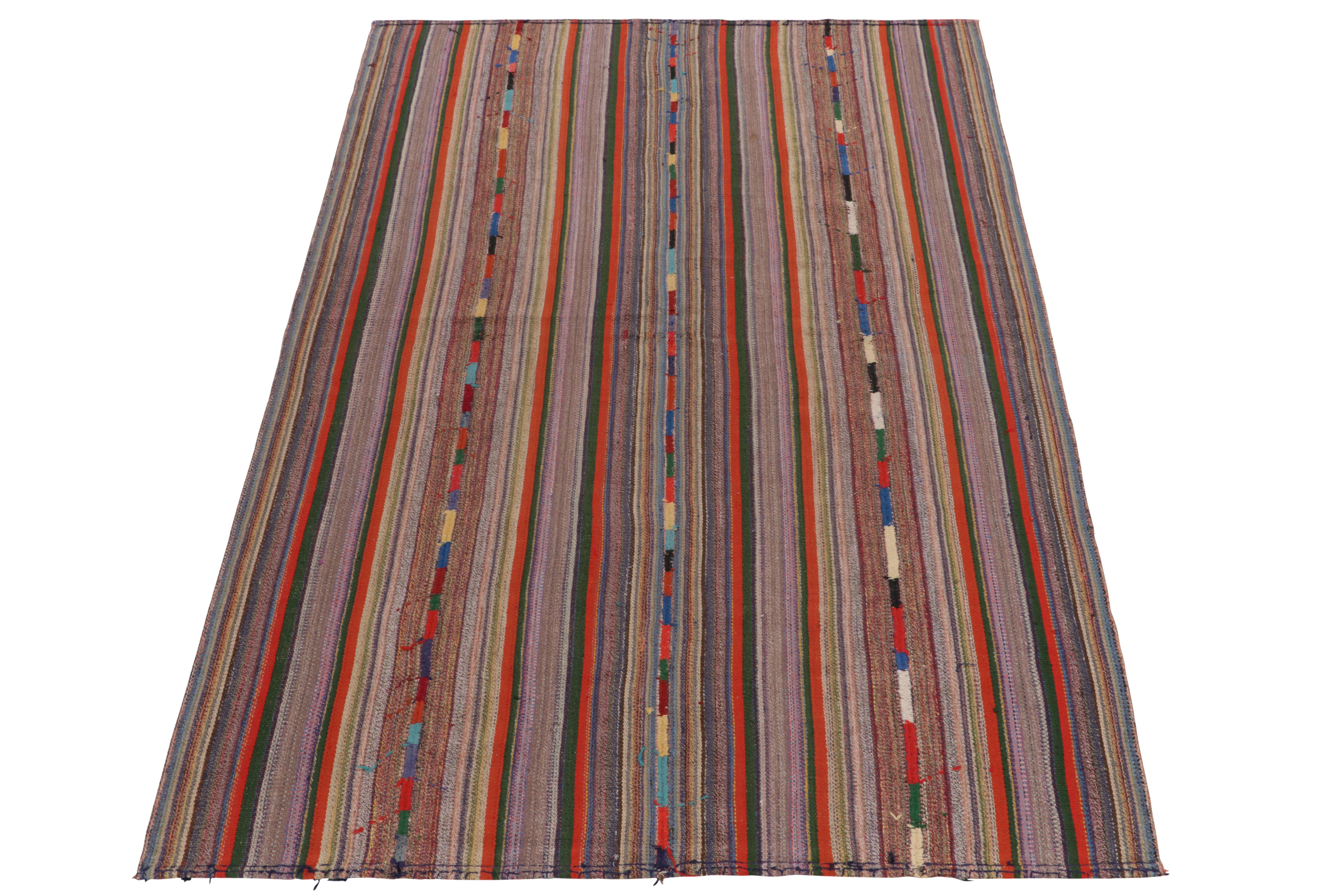 Originating from Turkey circa 1950-1960, a rare type of chaput kilim rug style now entering our Antique & Vintage selections. Characterized by fine detailing with the colors within the polychromatic stripes, the light & refreshing piece welcomes a