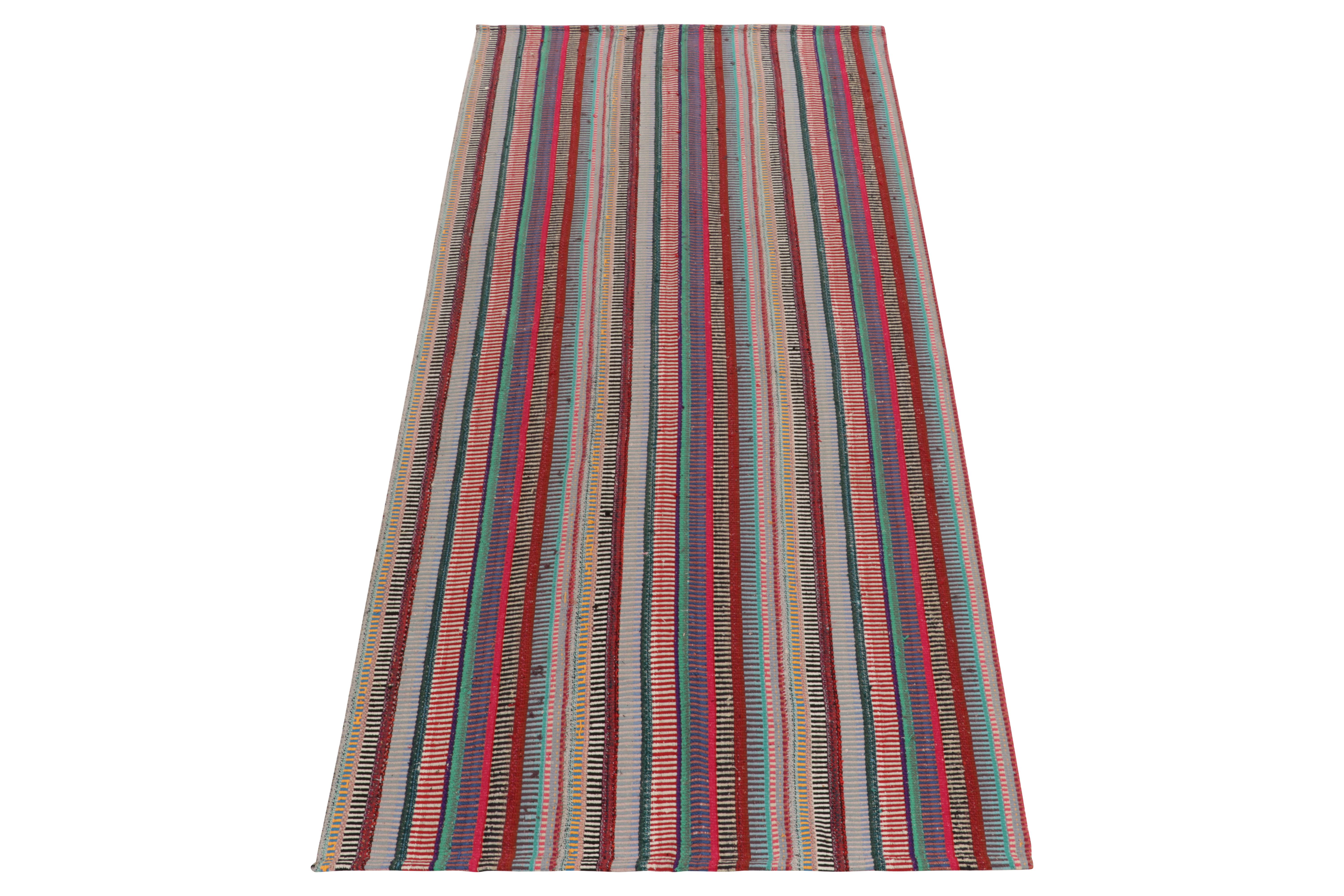 Originating from Turkey circa 1950-1960, a rare type of kilim rug style now entering our vintage flat weave selections. 

Characterized by fine detailing with the colors within the polychromatic stripes, the playful piece welcomes a departure from