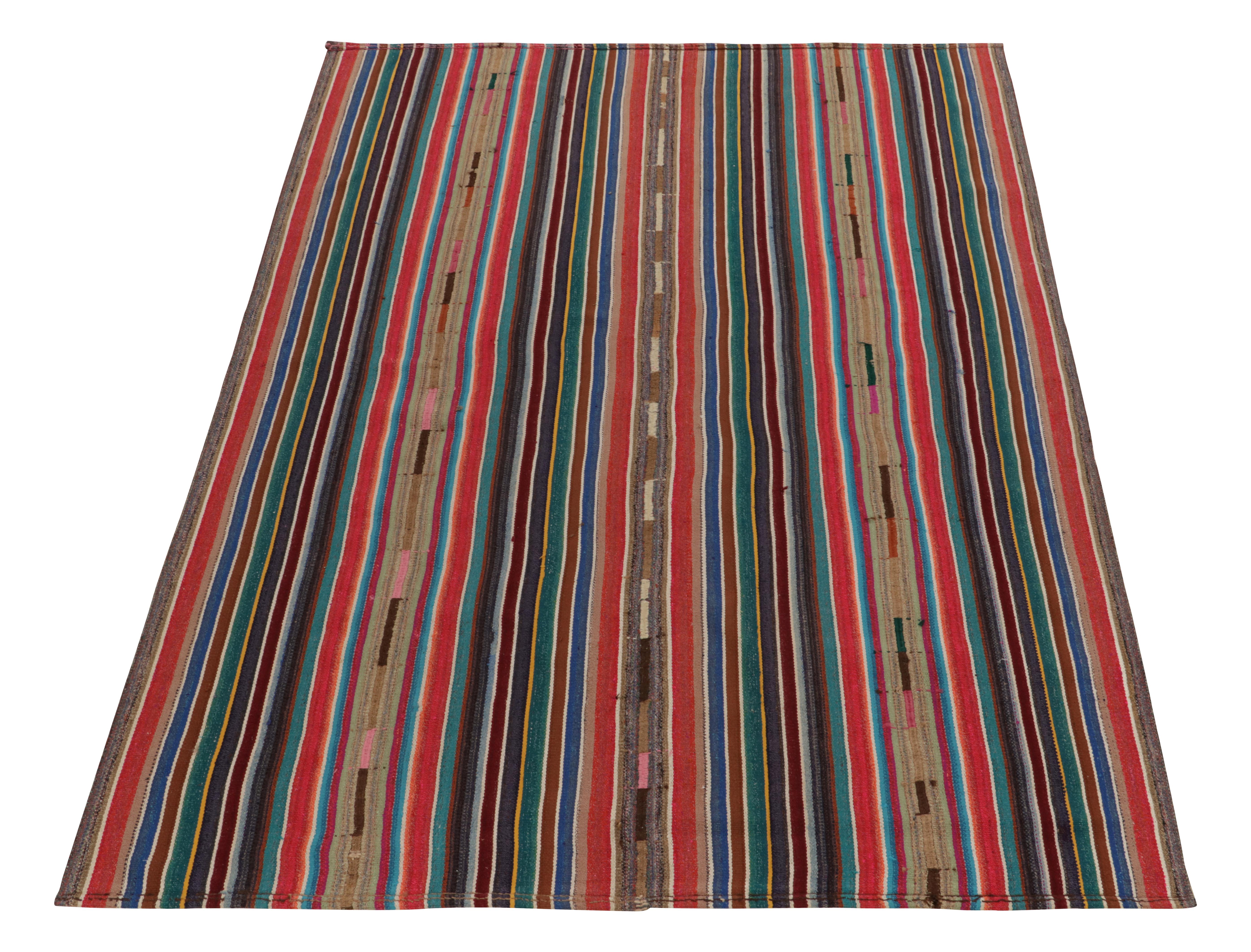Hailing from Turkey circa 1950-1960, a vintage chaput kilim rug from a rare new curation joining our flat weaves. Characterized by fine detailing with the colors within the polychromatic stripes, the lively piece welcomes a departure from