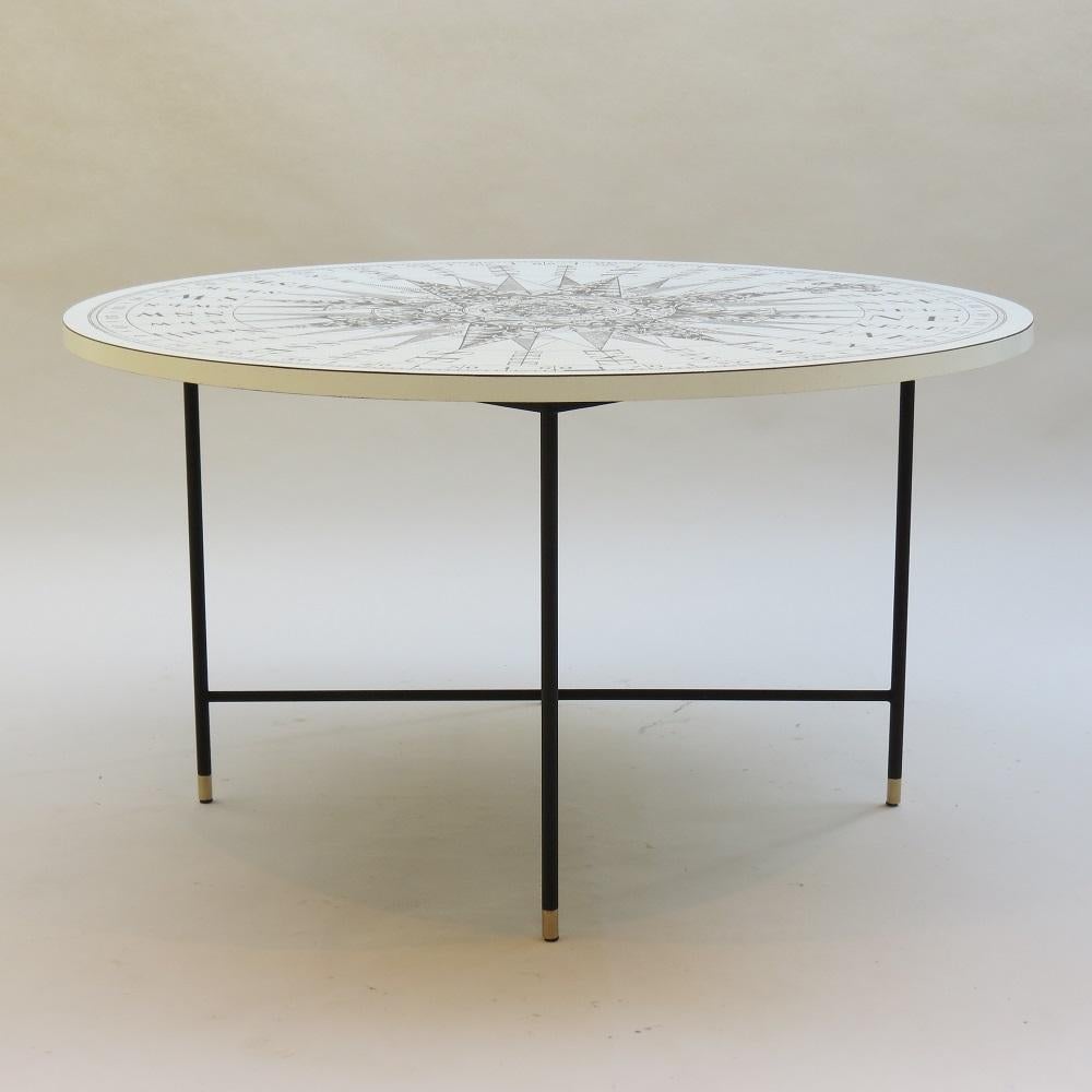 Wonderful good quality 1950s coffee table. Lovely detailed Formica top, black painted metal base with brass caps to the feet.
In good vintage condition, a few fine lines to the Formica top due to ageing. The top reads published by S Dunn, Clements