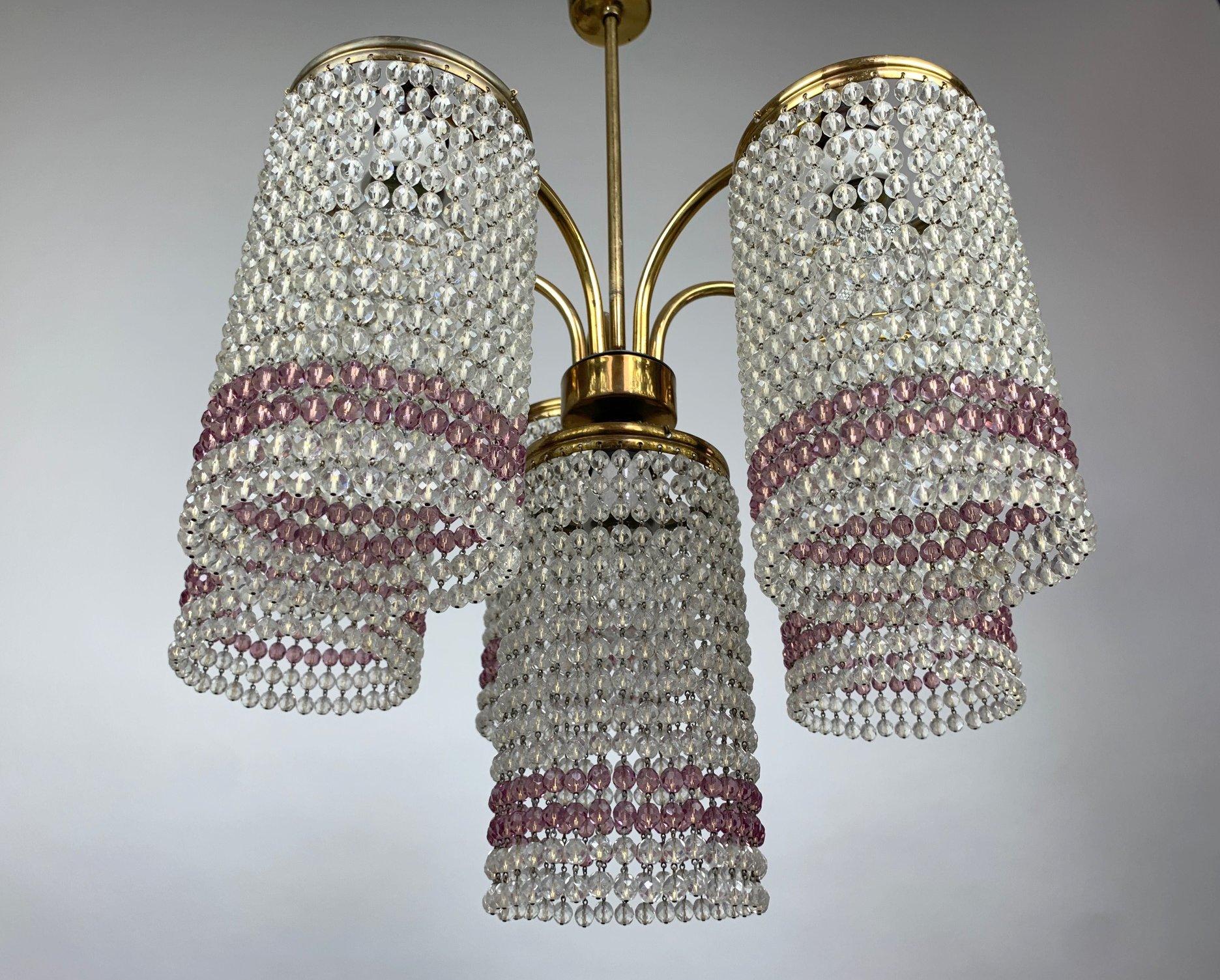 Beautiful vintage chandelier with clear and purplish coloured crystal beads. Made in former Czechoslovakia in the 1950's. Original wiring, fully functional. All the imperfections are visible in the photos. 
Bulbs: 6 x E27 or E26.