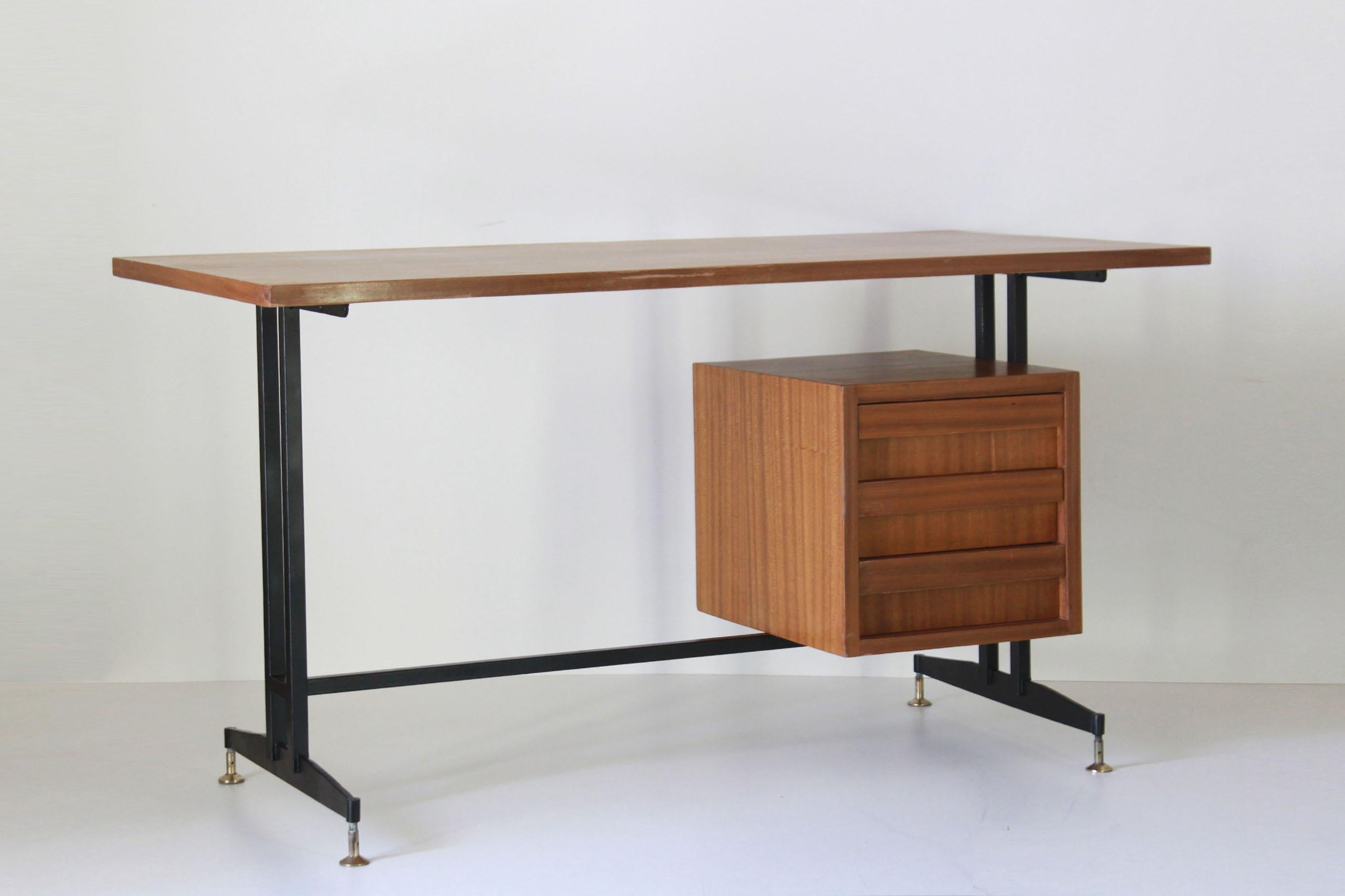 A 1950s vintage desk in Scandinavian style. Iron structure with brass feet and wood top in teak wood. Lateral chest of drawers. Fully restored. in very good conditions with only few signs of time.